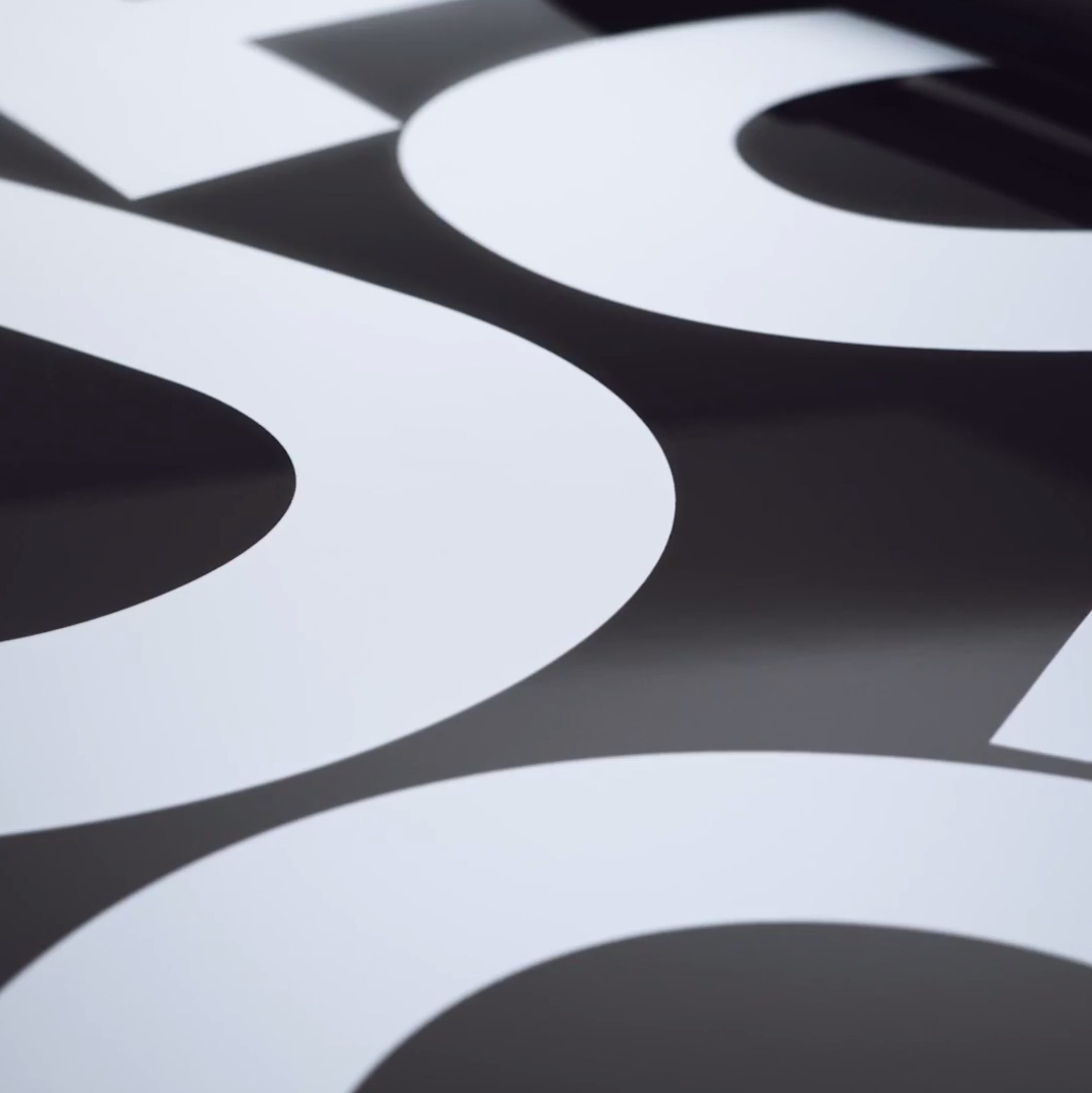 Close-up of a black Dacia Sandero Escape Limited Edition, typography by Automne Studio.