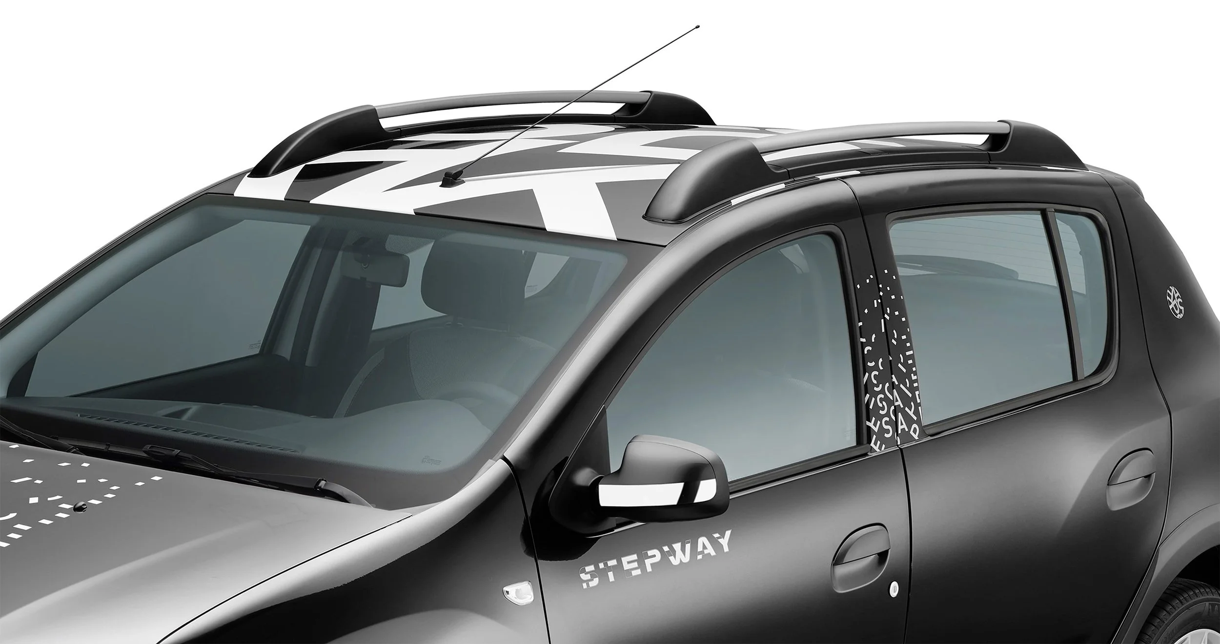 Close-up of a black Dacia Sandero Escape Limited Edition with roof rails, typography by Automne Studio.