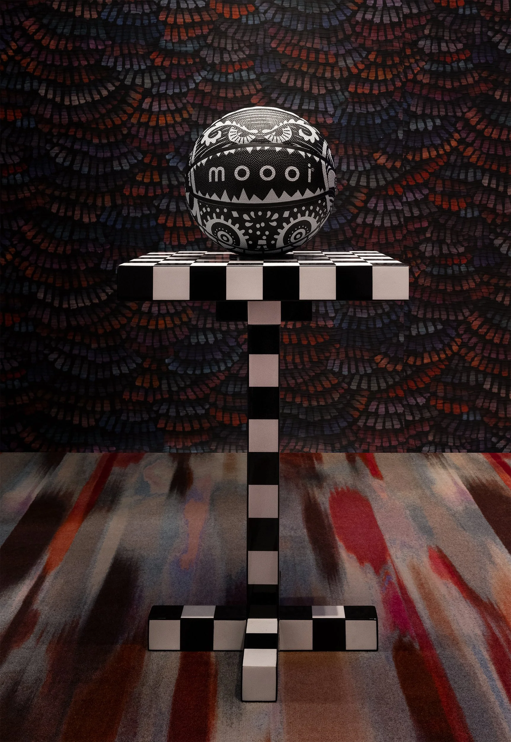 Black-and-white Moooi x Spalding basketball on a chess table, with the Marcel Wanders’ iconic Monster graphics, illustration project by Automne Studio.