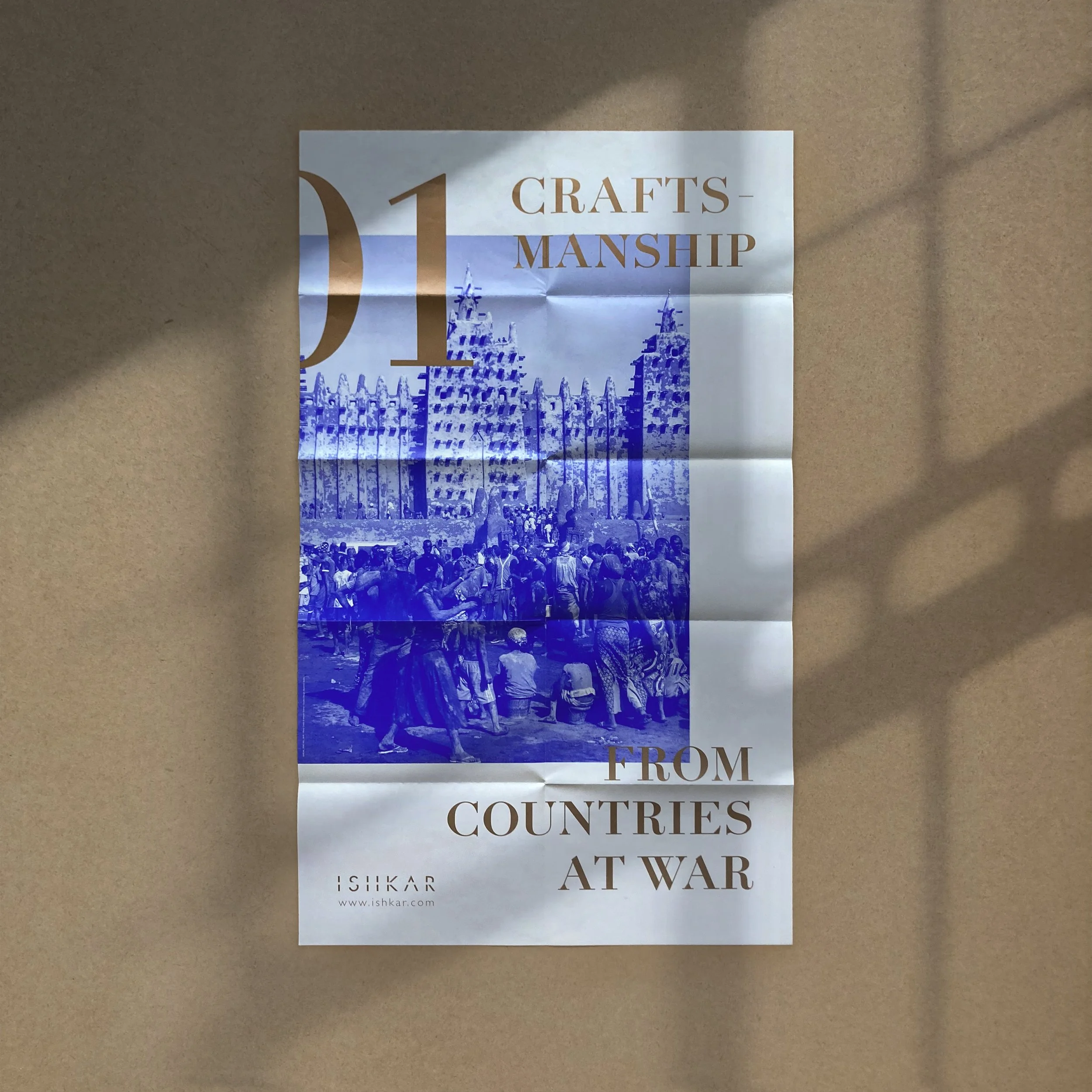 Poster with blue-and-gold graphic designs, Ishkar Zine, craftsmanship from countries at war, editorial project by Automne Studio.