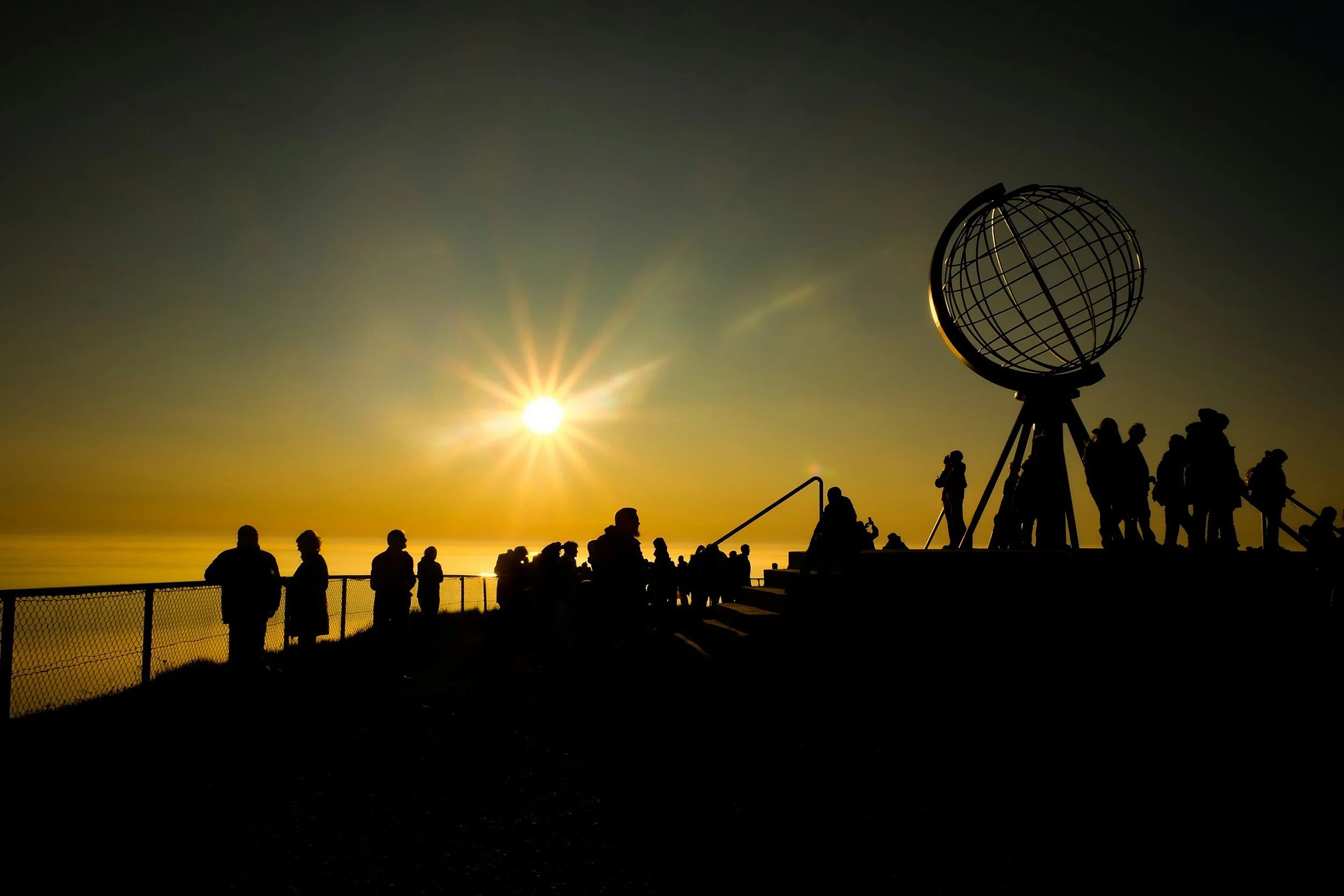 Midnight Sun above the Globe Monument at North Cape, Norway