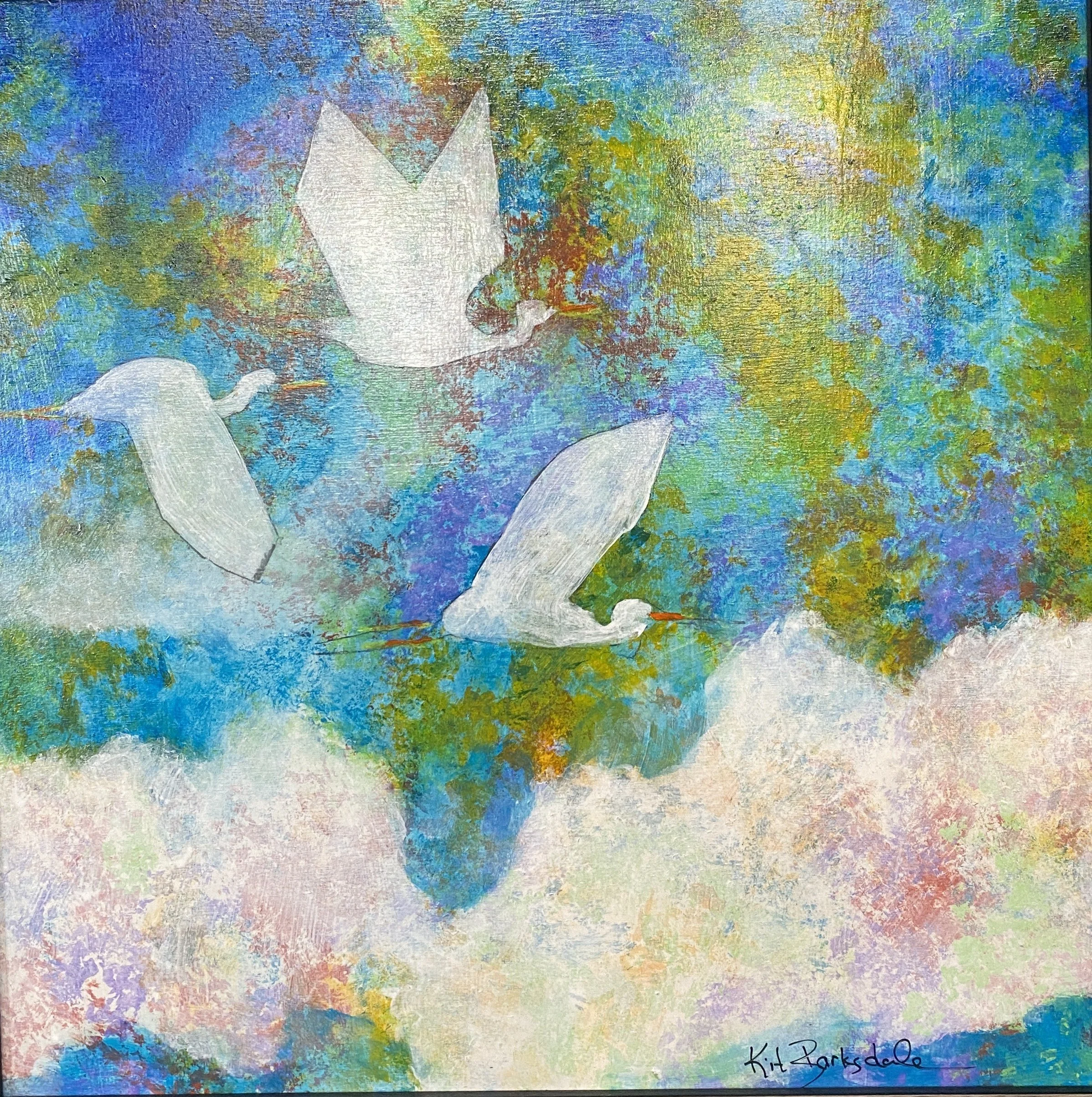 Painting of four white swans flying over colorful clouds and sky, with artist signature 'Kit Parksdale' in the bottom right corner.