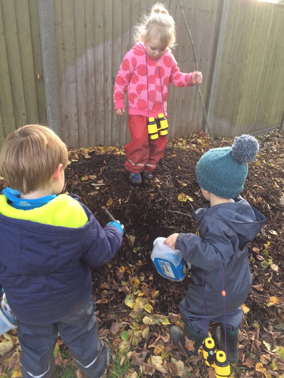 Our intrepid explorers scaling a mountain of leaves