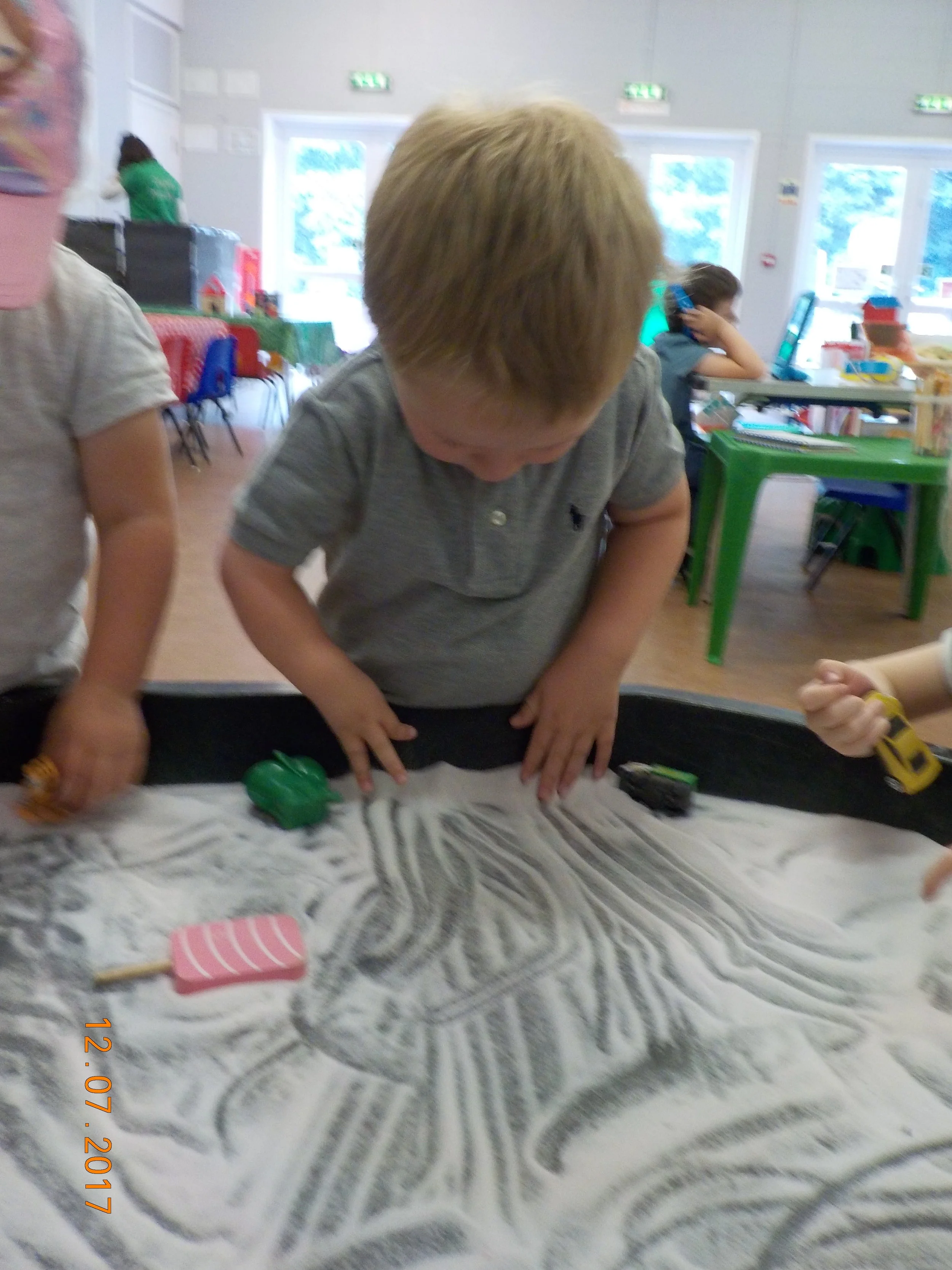 Mark making in the sand tray