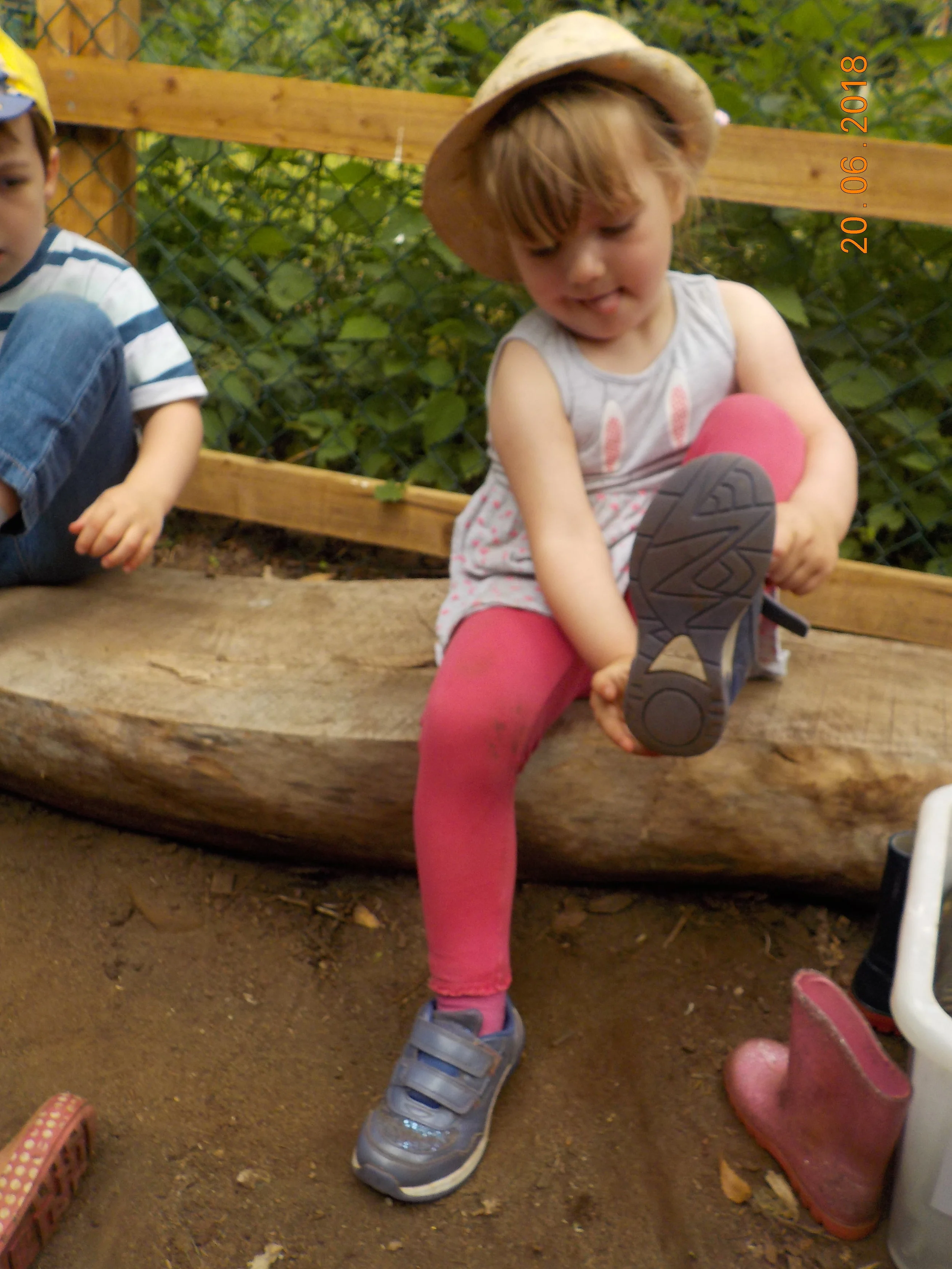 Putting on her shoes all by herself!