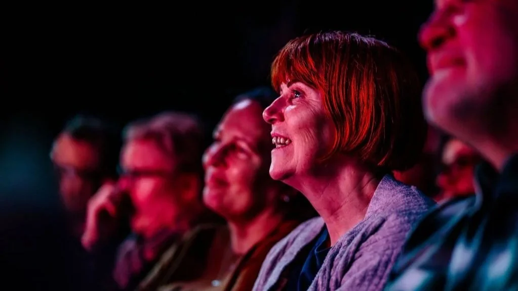 Audience members smiling at The Gaffe Comedy Club