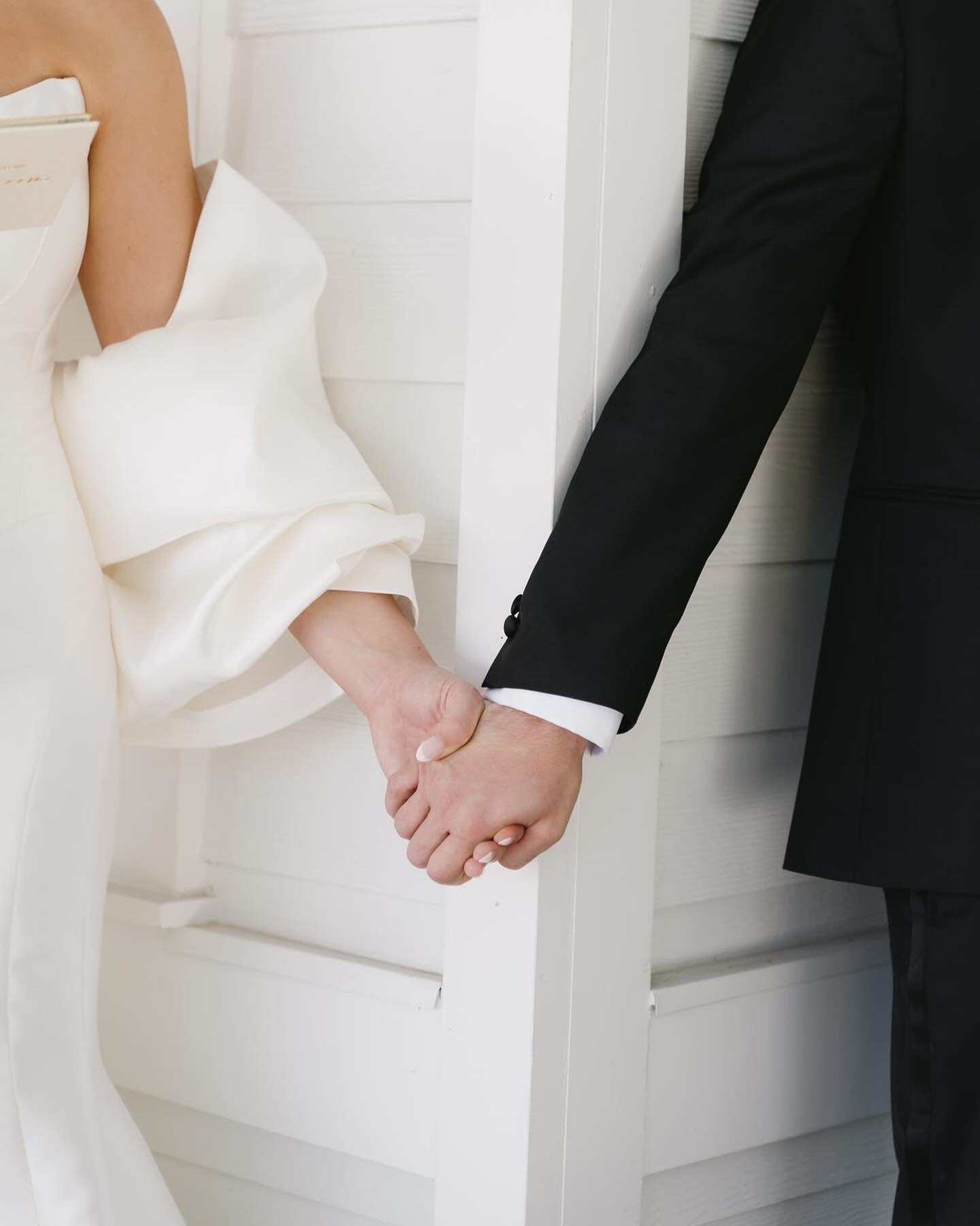 A first touch &mdash; a quiet moment before the aisle. Hands meet around a corner, nerves settle, and for just a minute the entire day slows down. 💭

Planning: @elegantaffairsbydesign 
Cake: @chantilly_cakes_largo
Dress: @athenasbridal
DJ: @ghamobil