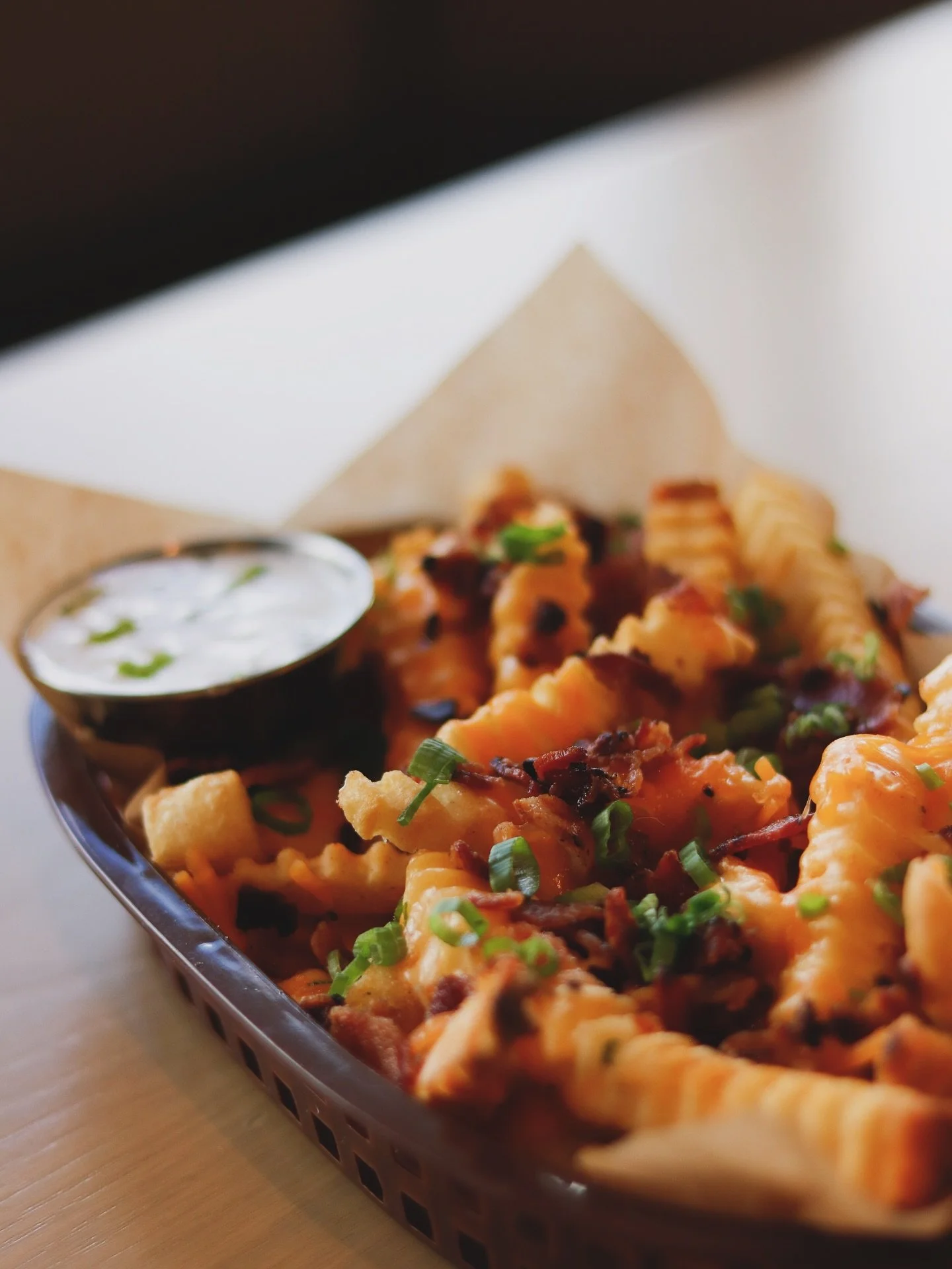 Cheesy Fries // ‼️ New Menu Item ‼️Crinkle cut fries loaded with melty cheese sauce, crispy bacon, and bright scallions. This dish is instantly craveable Get in and get over the midweek hump. Napkins are optional, regret not. 

Perfect for sharing
Pe