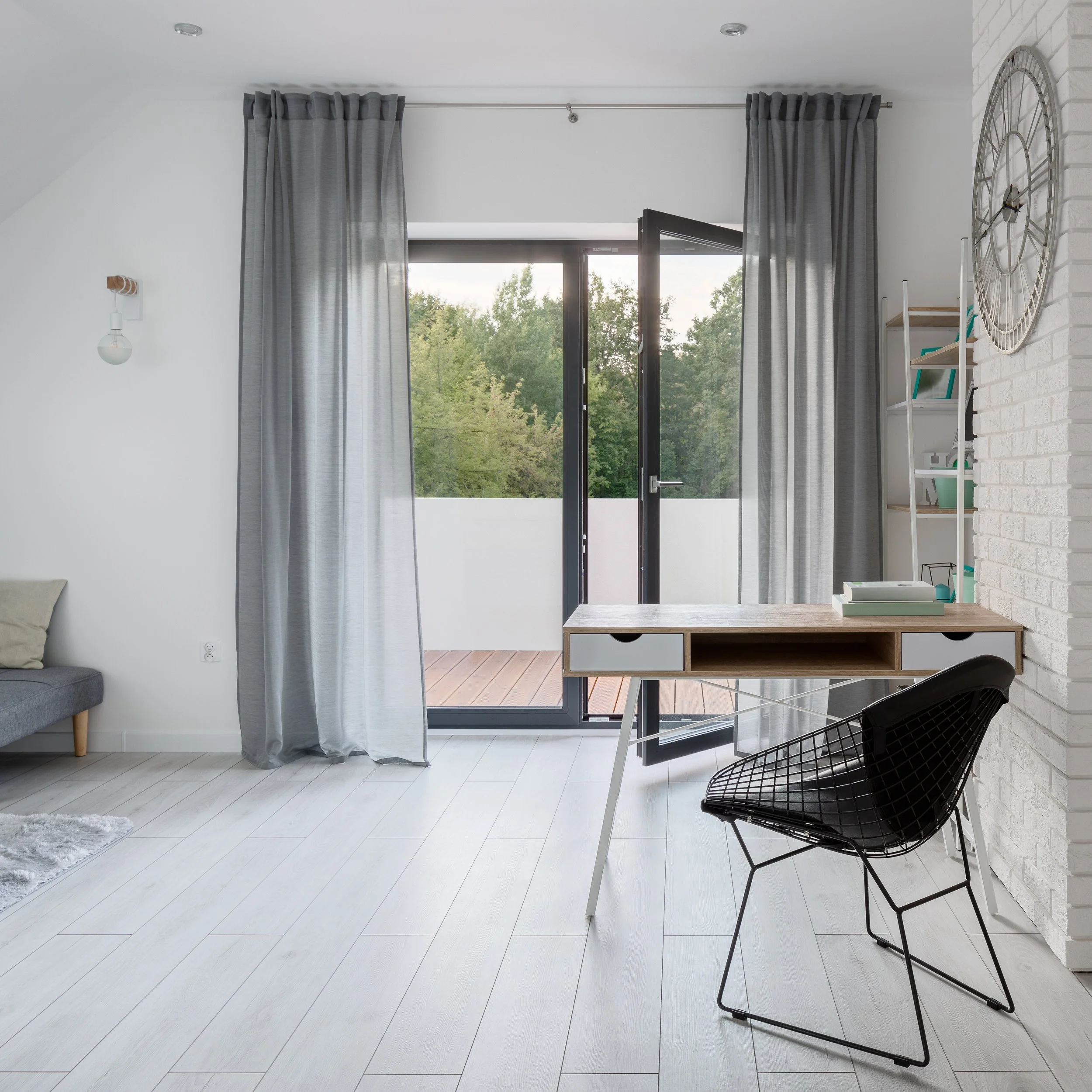 Light room with an open door to the balcony
