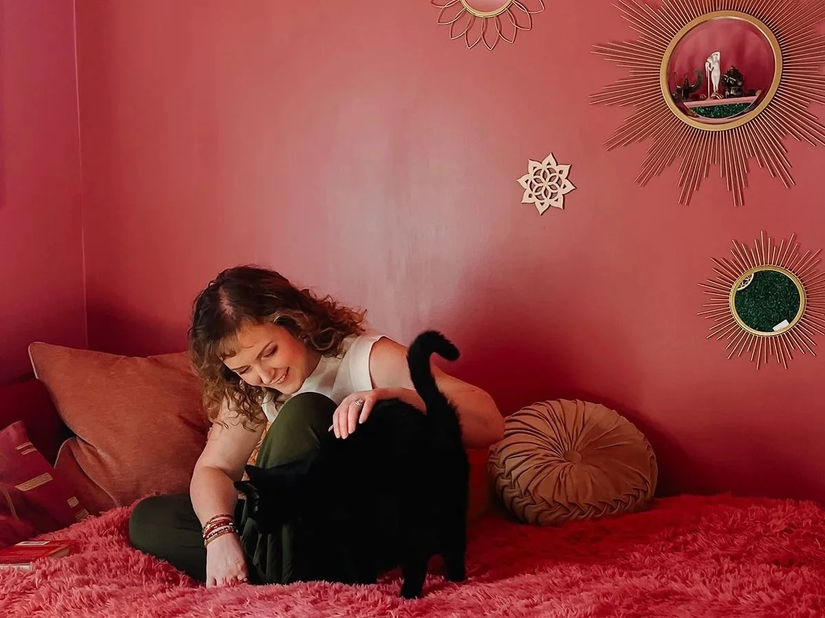 moyra-home-with-cat-in-cozy-room.jpg