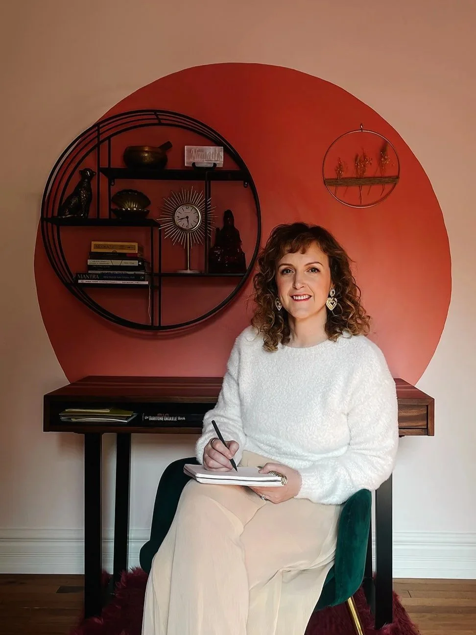 Moyra-michelle-hypnotherapy-sitting-on-chair-journal-q&a
