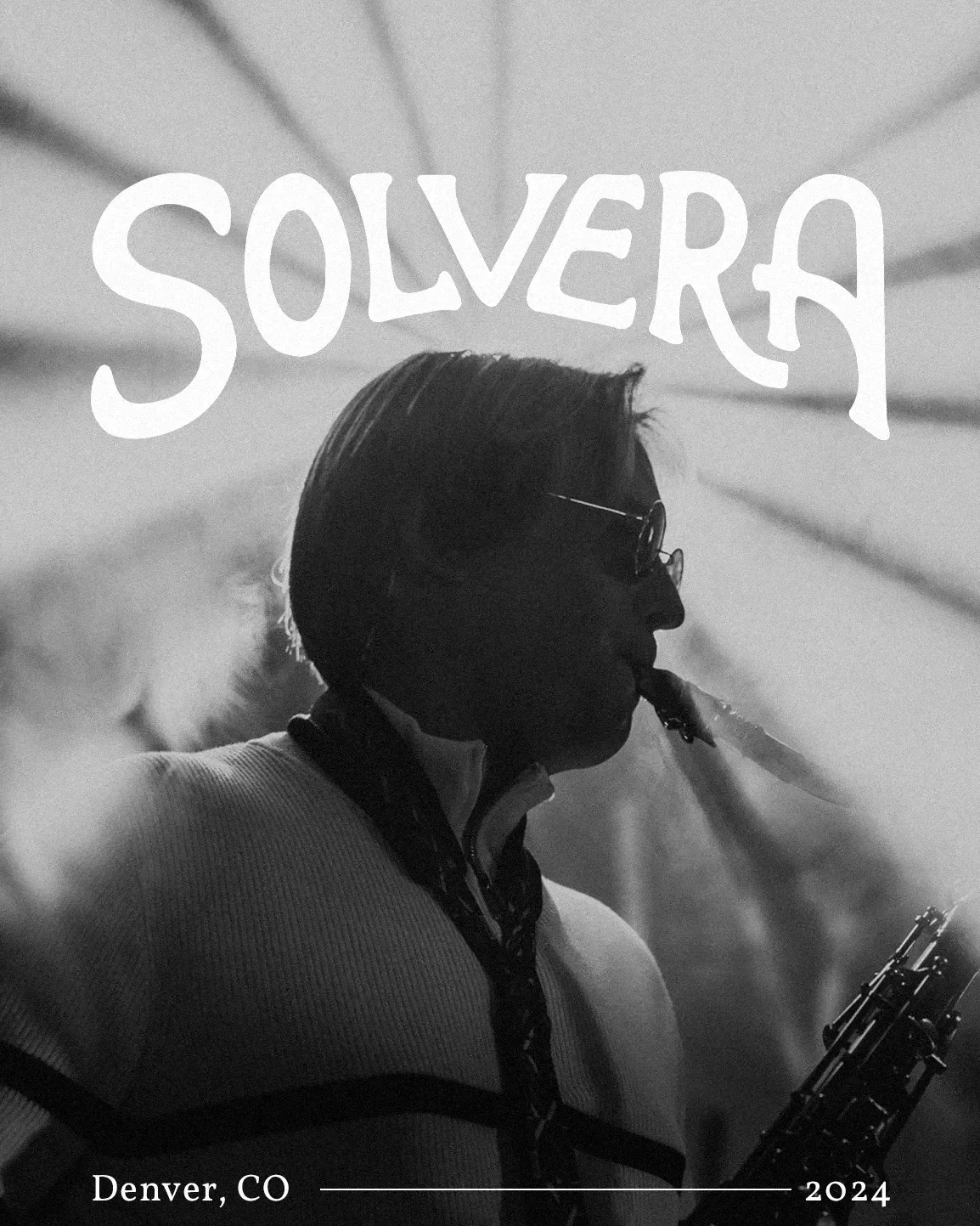 Black and white photo of a man wearing sunglasses, smoking a cigar, holding a saxophone, and looking to the right. The word "SOUVER" is in bold white letters at the top, with "Denver, CO" and "2024" at the bottom.