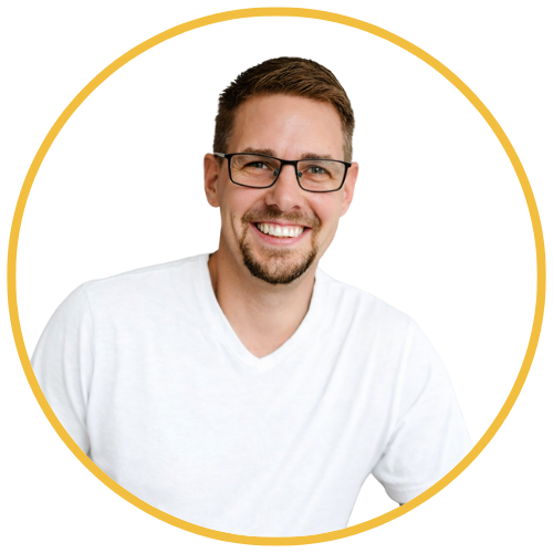 Headshot of Steve Holt with bright old shops in the background