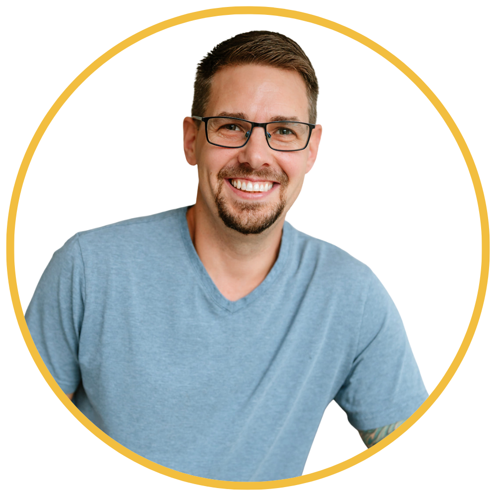 Headshot of Steve Holt with bright old shops in the background