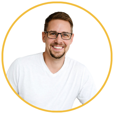 Headshot of Steve Holt with bright old shops in the background