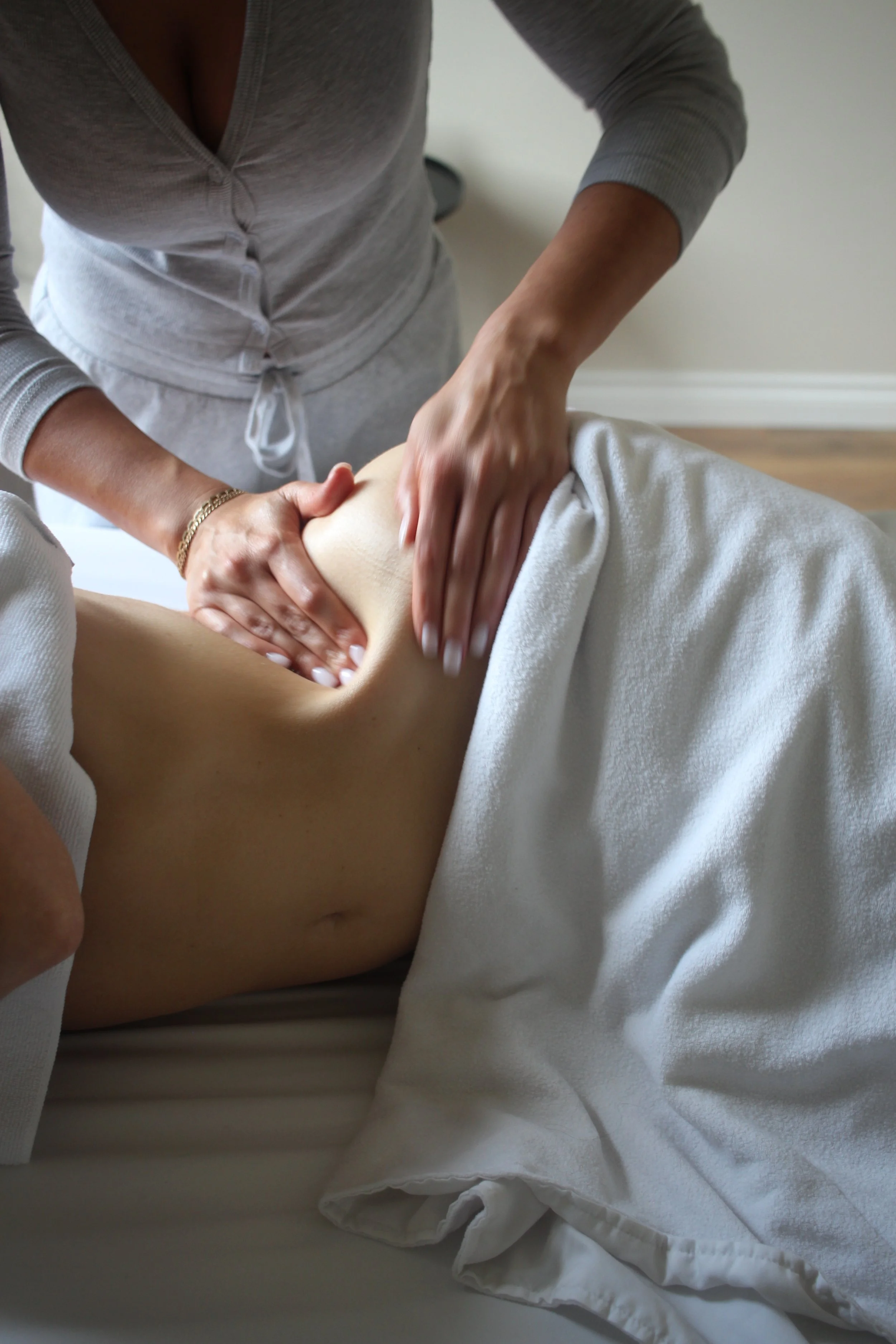 Woman performing lymphatic massage