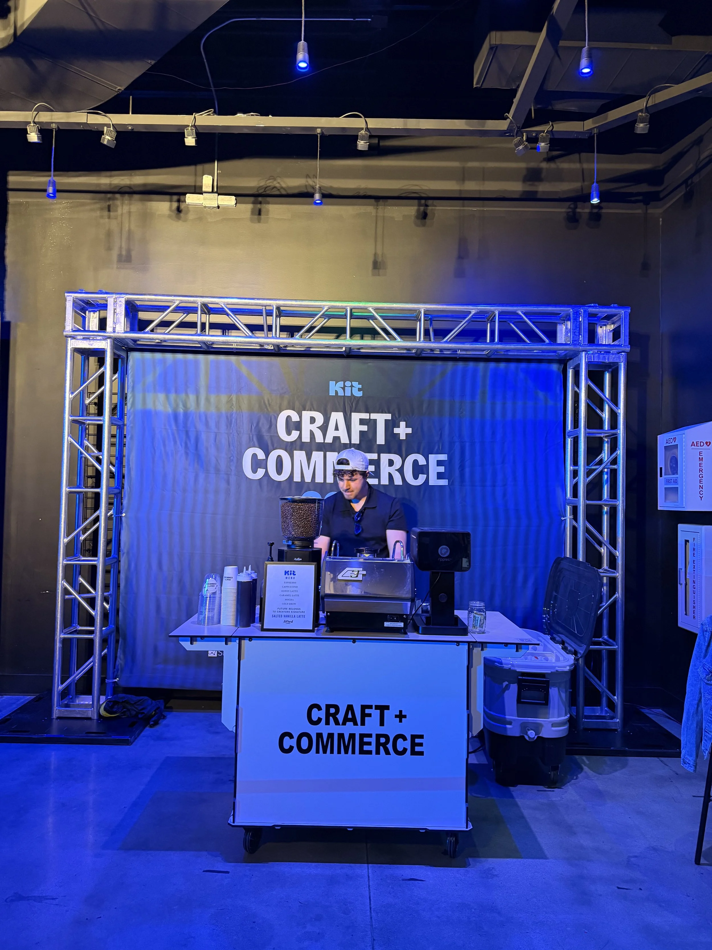 Conference attendees networking around a mobile coffee cart serving handcrafted espresso drinks during a corporate event in Boise, Idaho.