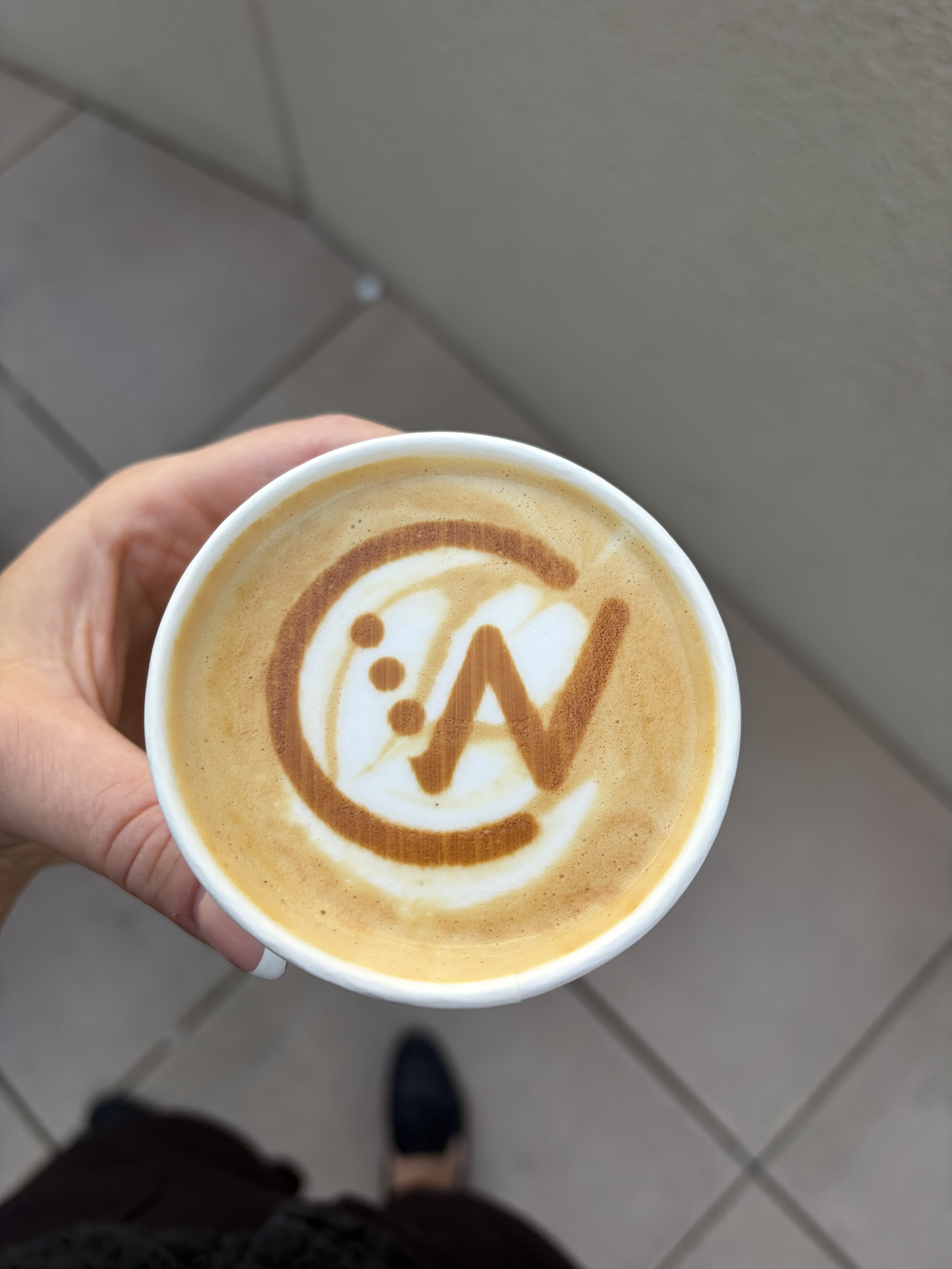 Company logo printed on a latte for a custom branded corporate coffee experience