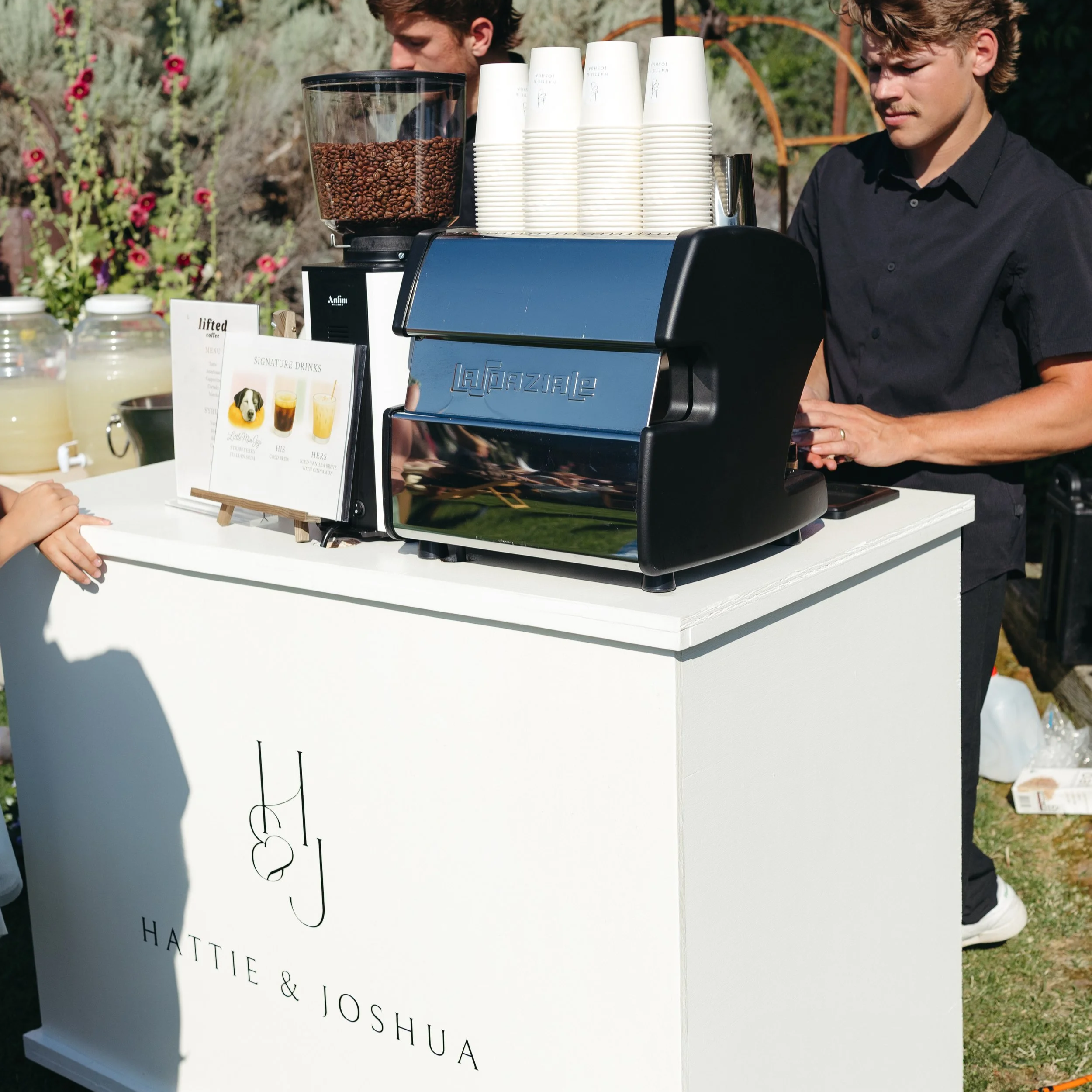 Custom branded Lifted Coffee Cart wedding espresso bar with couple's monogram at an Idaho wedding reception
