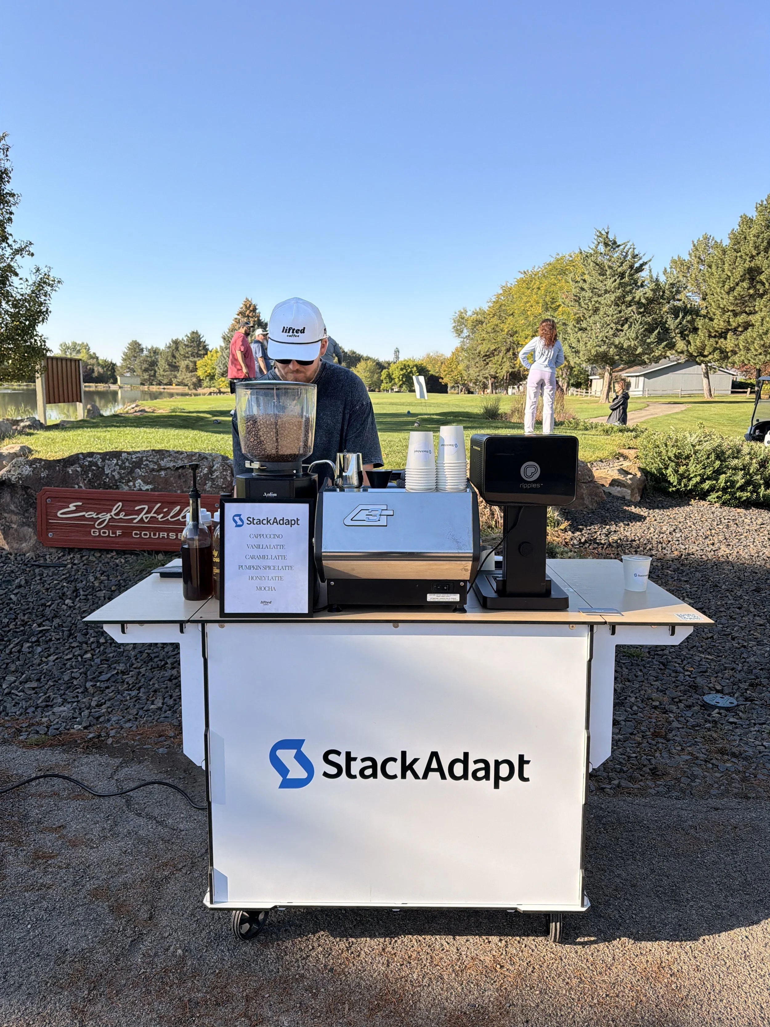 Professional barista serving handcrafted drinks at a Boise corporate holiday party