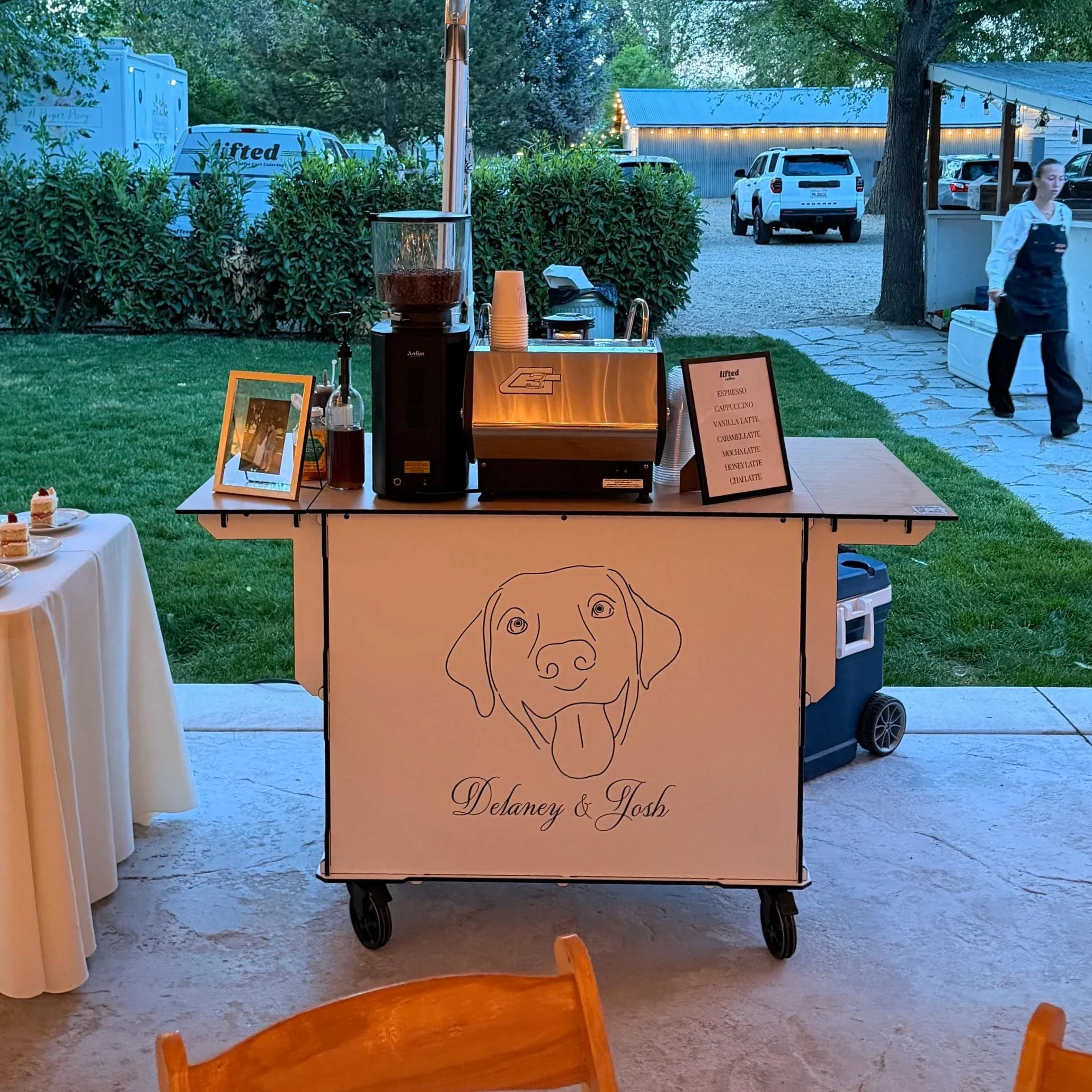 Custom branded Lifted Coffee Cart wedding espresso bar under a reception tent at a Boise Idaho wedding