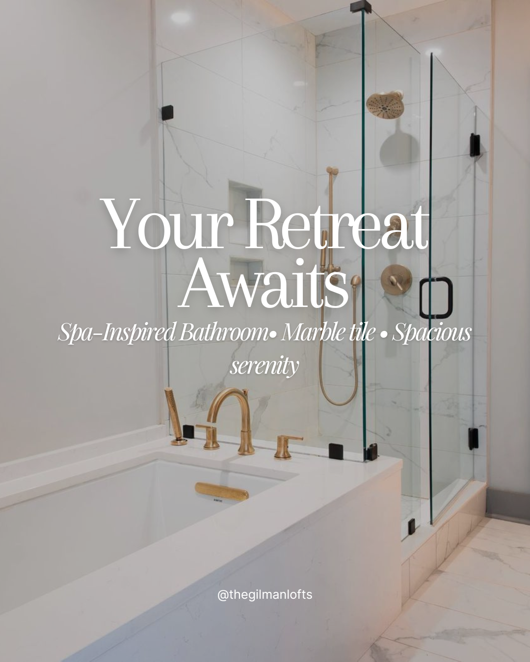 A spa-inspired bathroom with a marble tile shower and bathtub, featuring gold fixtures.