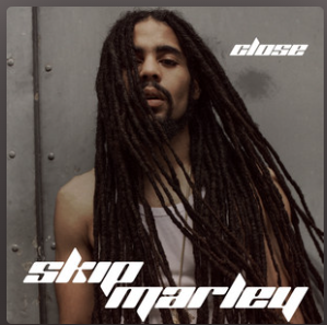Album cover for Skip Marley's "Close" featuring a person with long dreadlocks and a sleeveless top.
