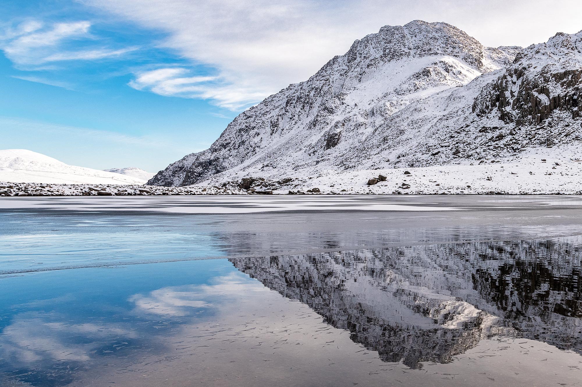 Tryfan during a winter snowfall at Cwm Idwal in Eryri Snowdonia