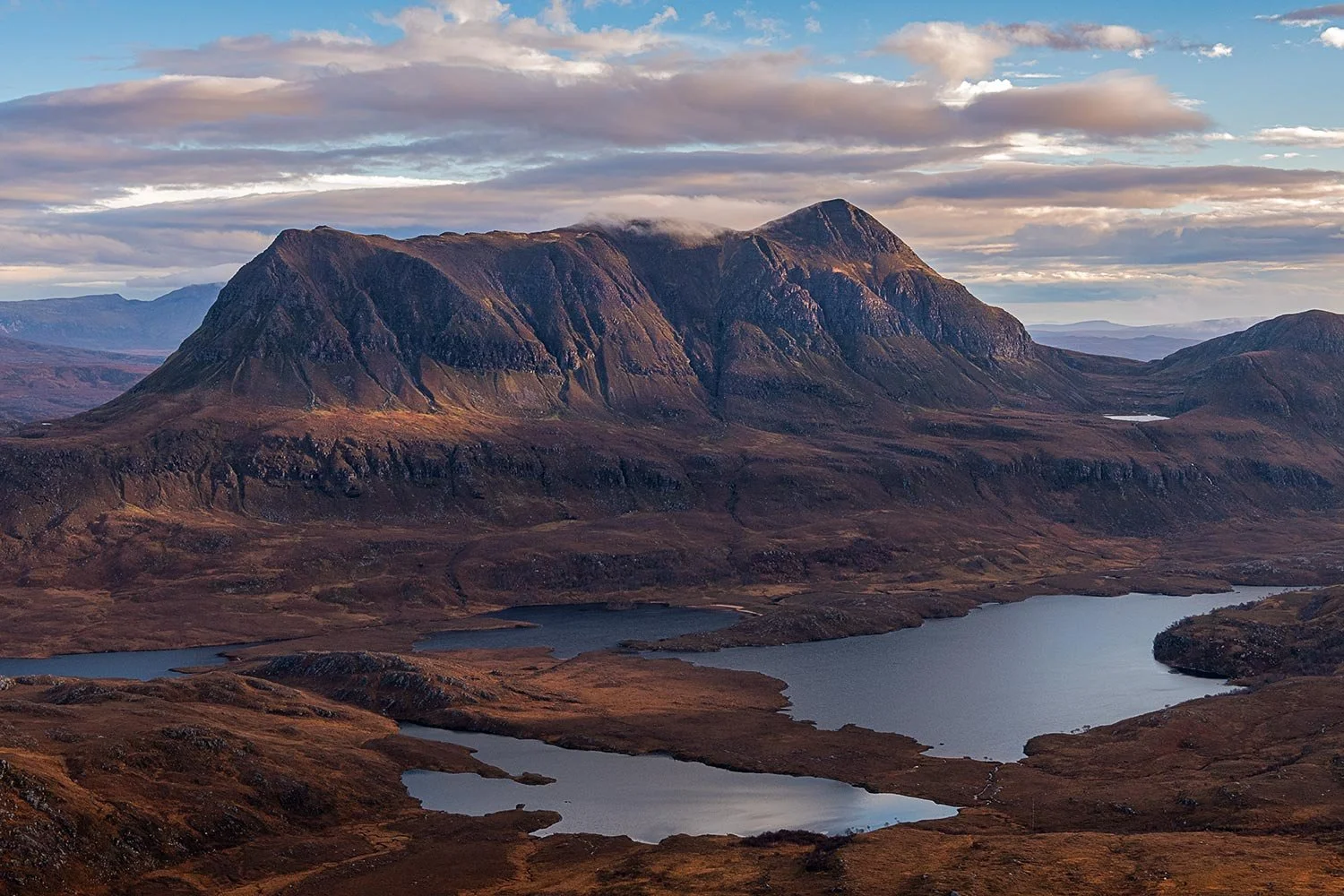 Beautiful morning light on the rocky crags of Cul Mor from Stac Pollaidh mountain.
