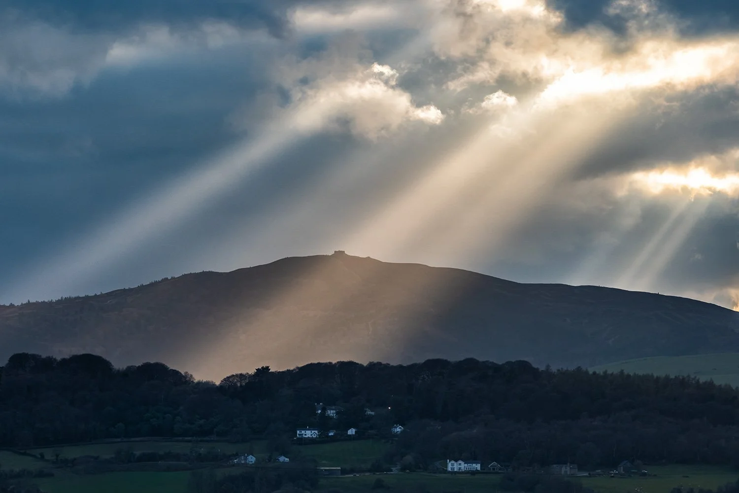 A stunning sunset sunburst over Moel Famau in the Clwydian Hills.