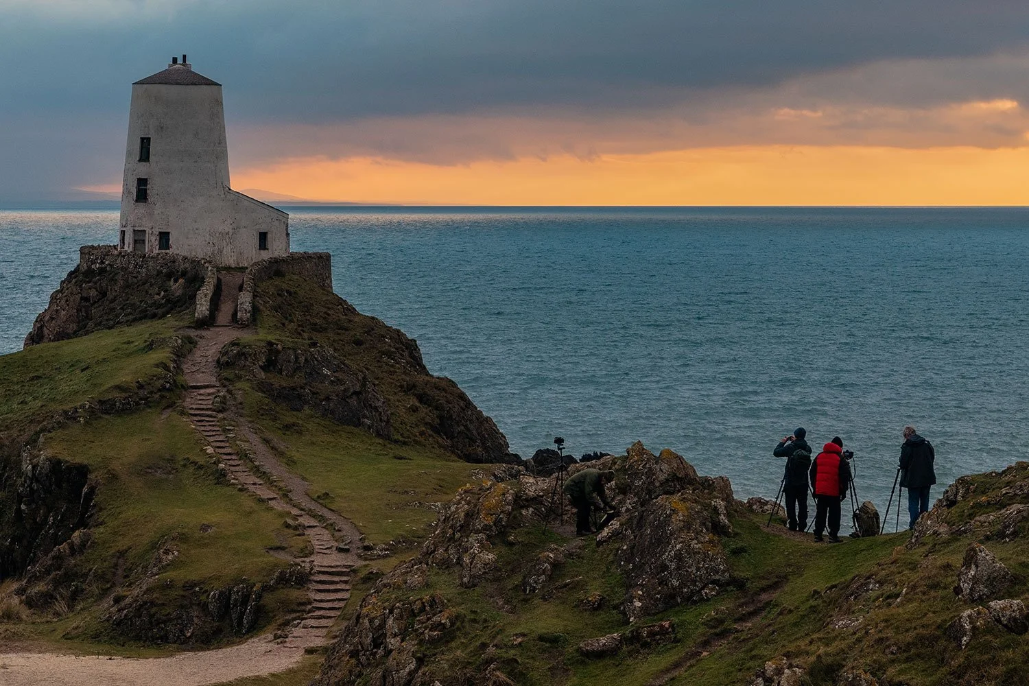 The Anglesey workshop group waiting for sunset at Twr Mawr lighthouse on Llanddwyn Island