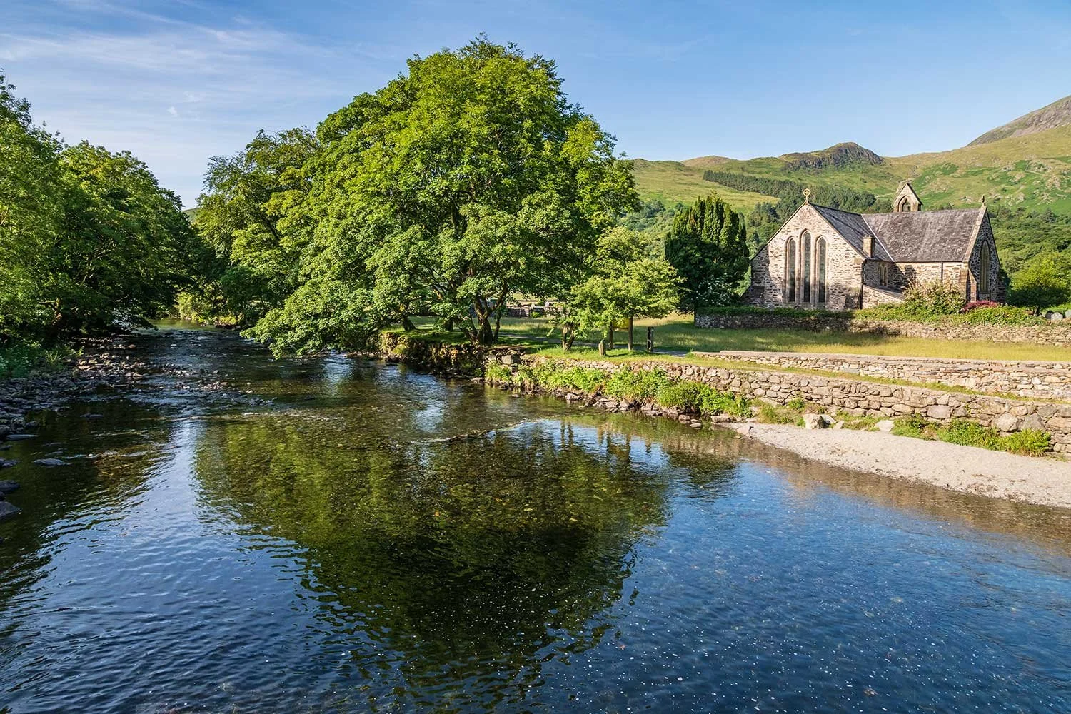 The Afon Glaslyn flowing past St Mary's Church