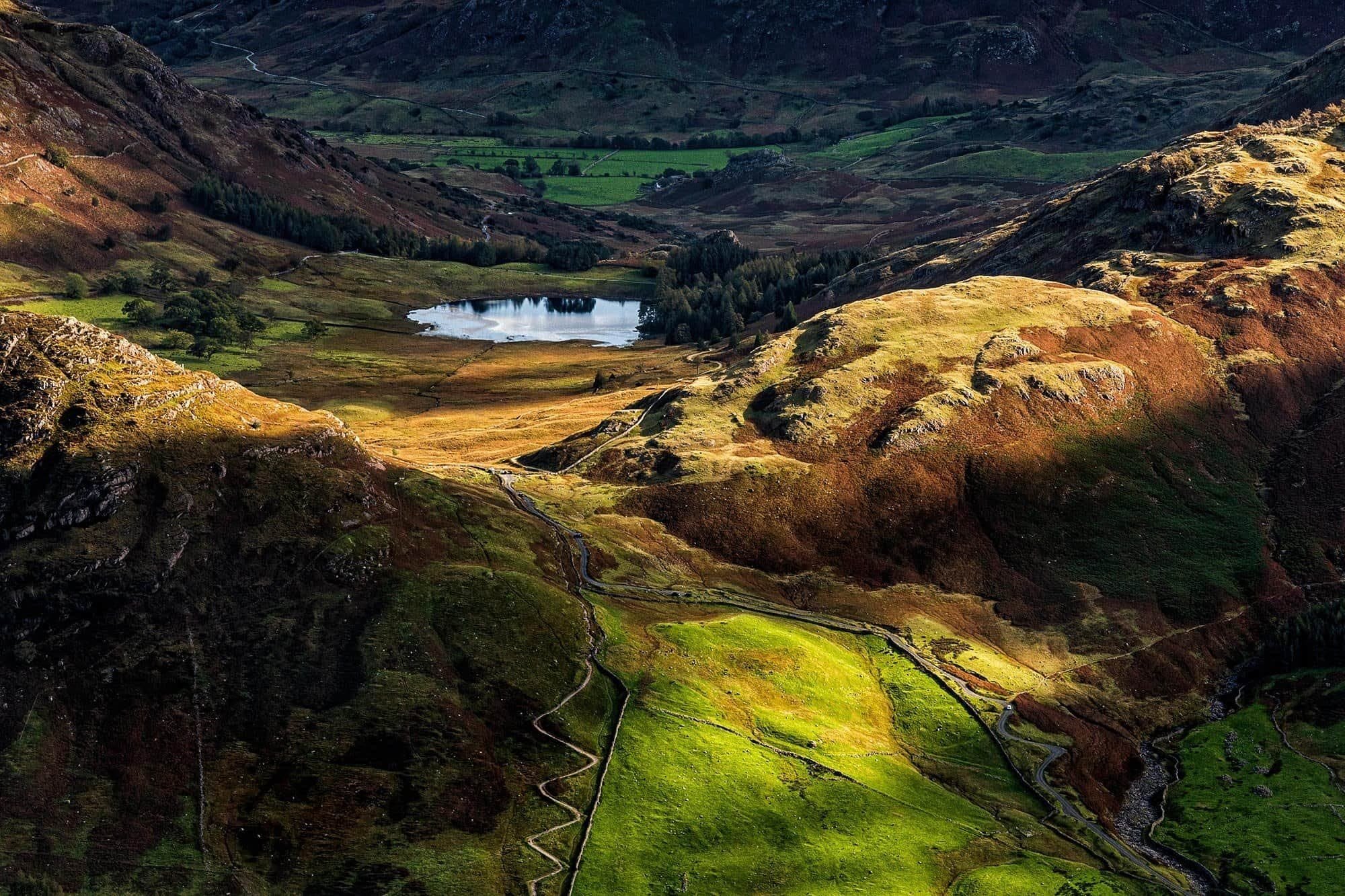 Expansive view of Blea Tarn from atop the Langdale Pikes, Lake District.
