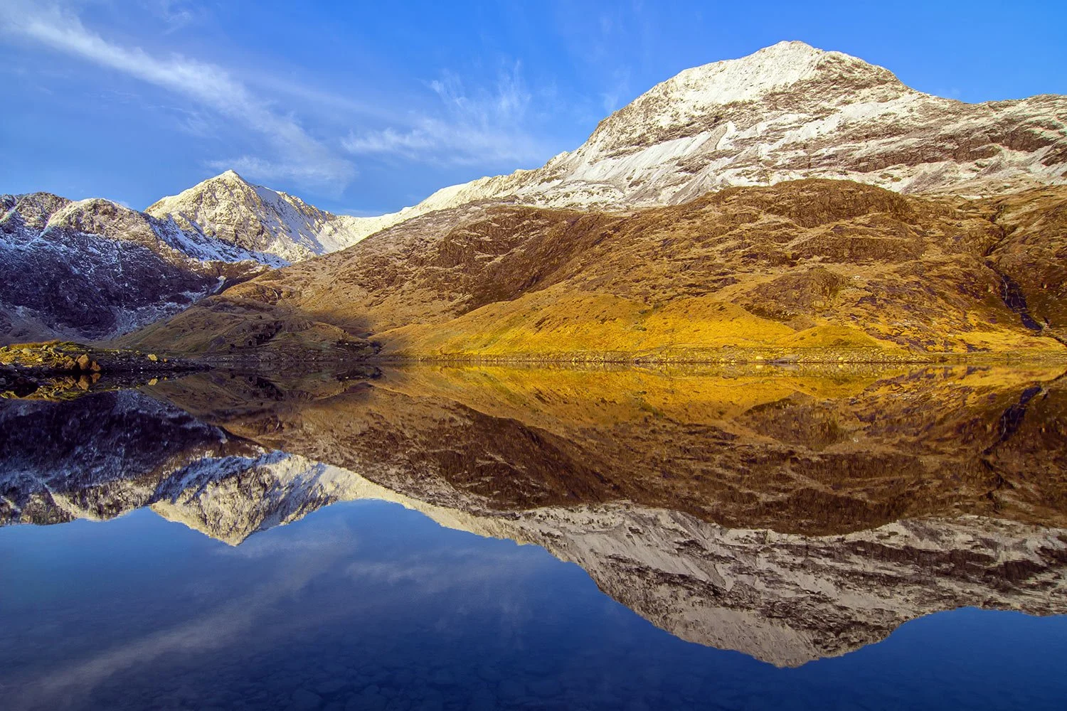 Snowdon and Crib Goch sunrise reflections in Llyn Llydaw from the Miners Track.
