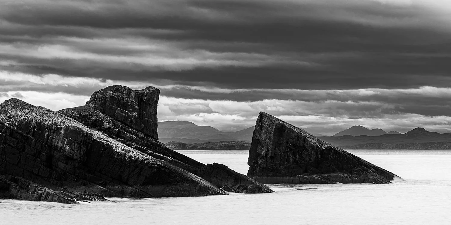 Dramatic clouds over Split Rock Clachtoll beach.