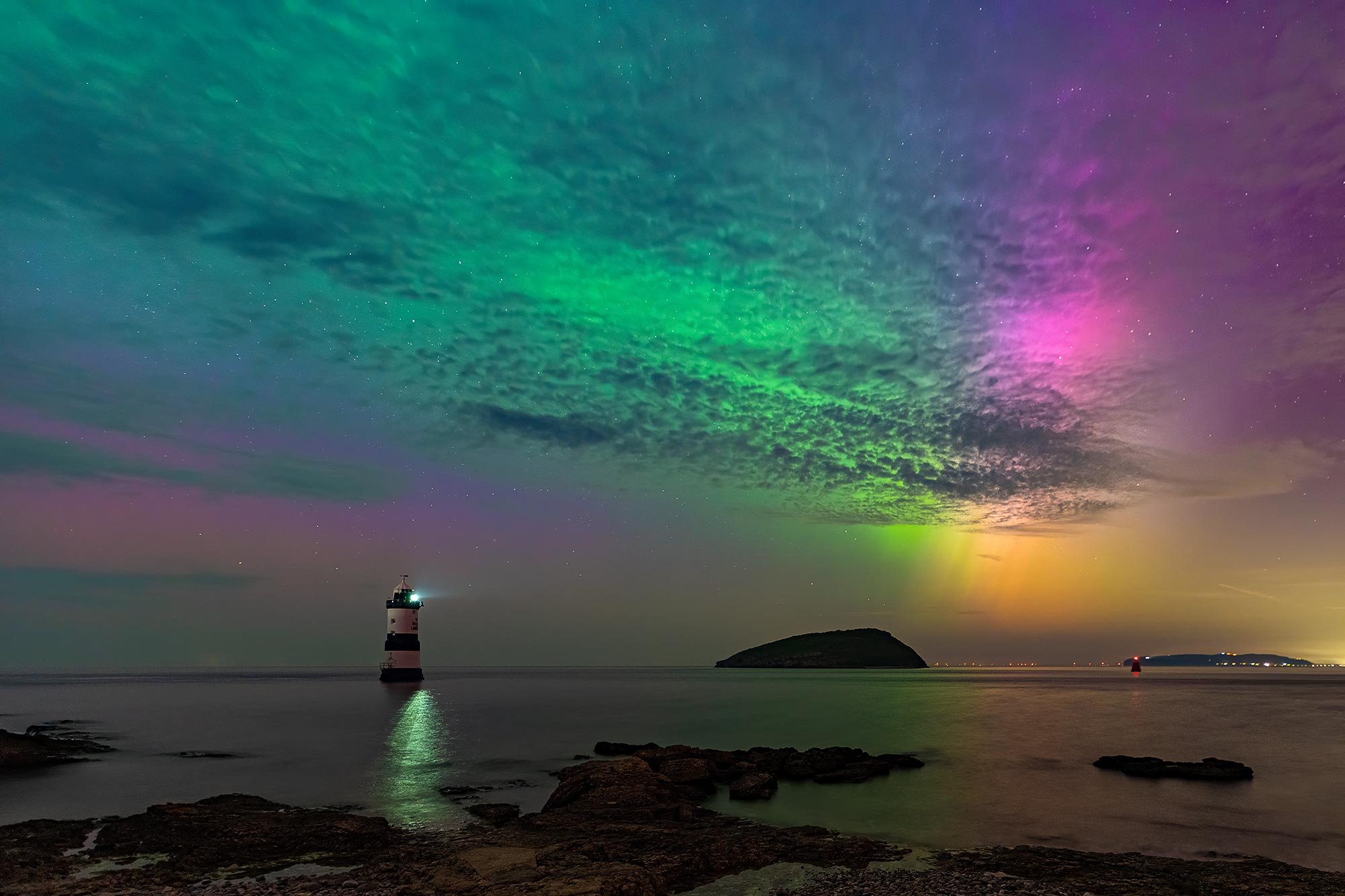 Amazing Northern lights and aurora at Penmon lighthouse on Anglesey in North Wales
