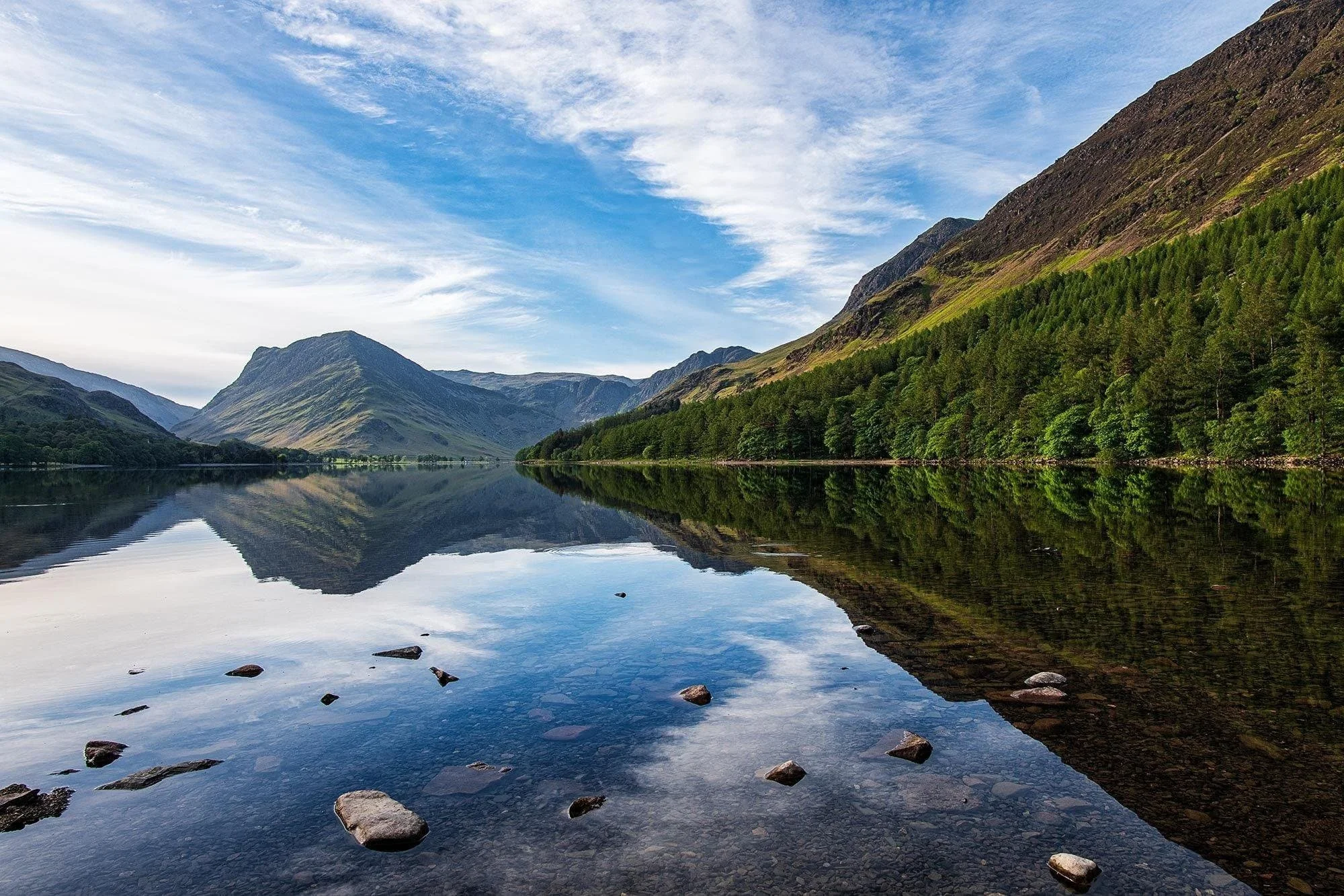 Mirror-like reflections of Buttermere framed by peaks in the Lake District photography gallery..