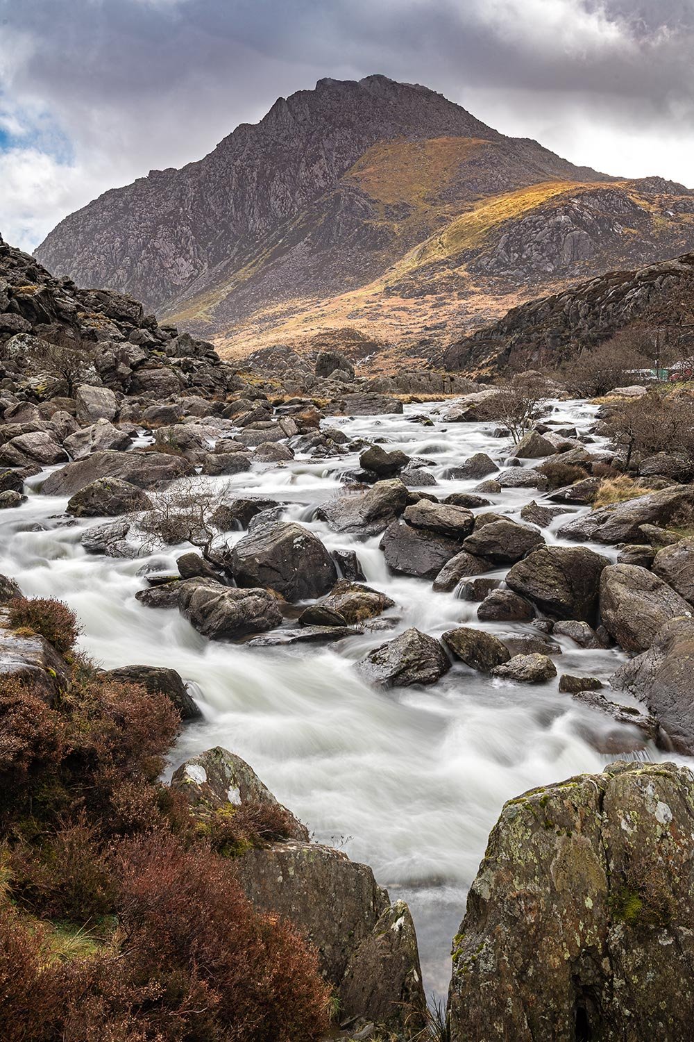 Tryfan view from Ogwen Falls waterfall in Eryri Snowdonia.