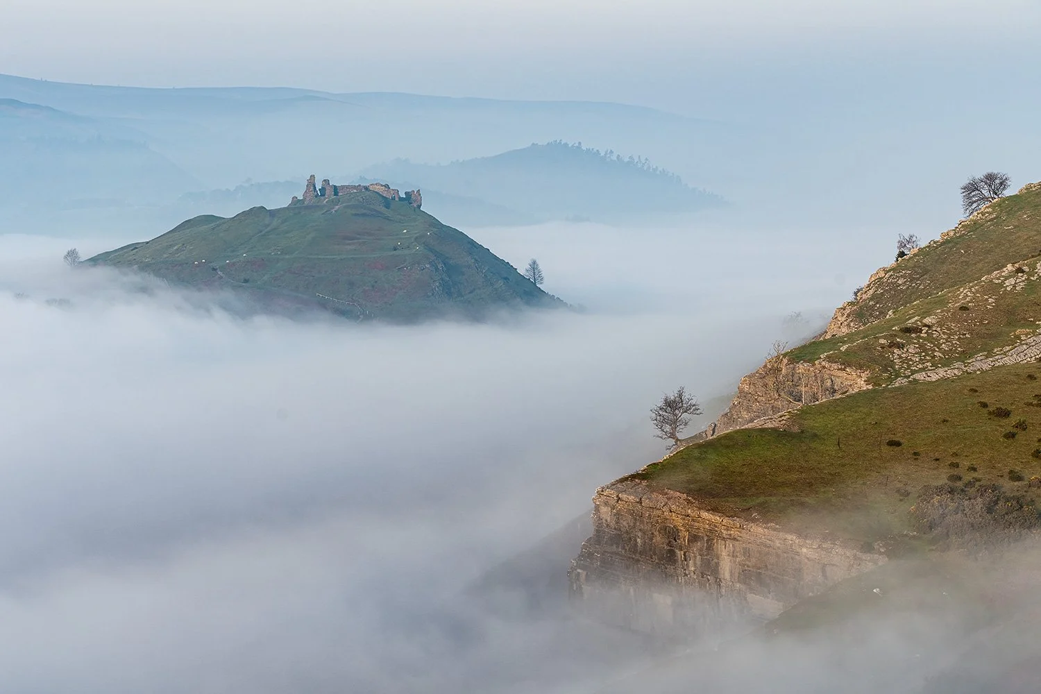 Trevor Rocks and Castell Dinas Bran shrouded in mist