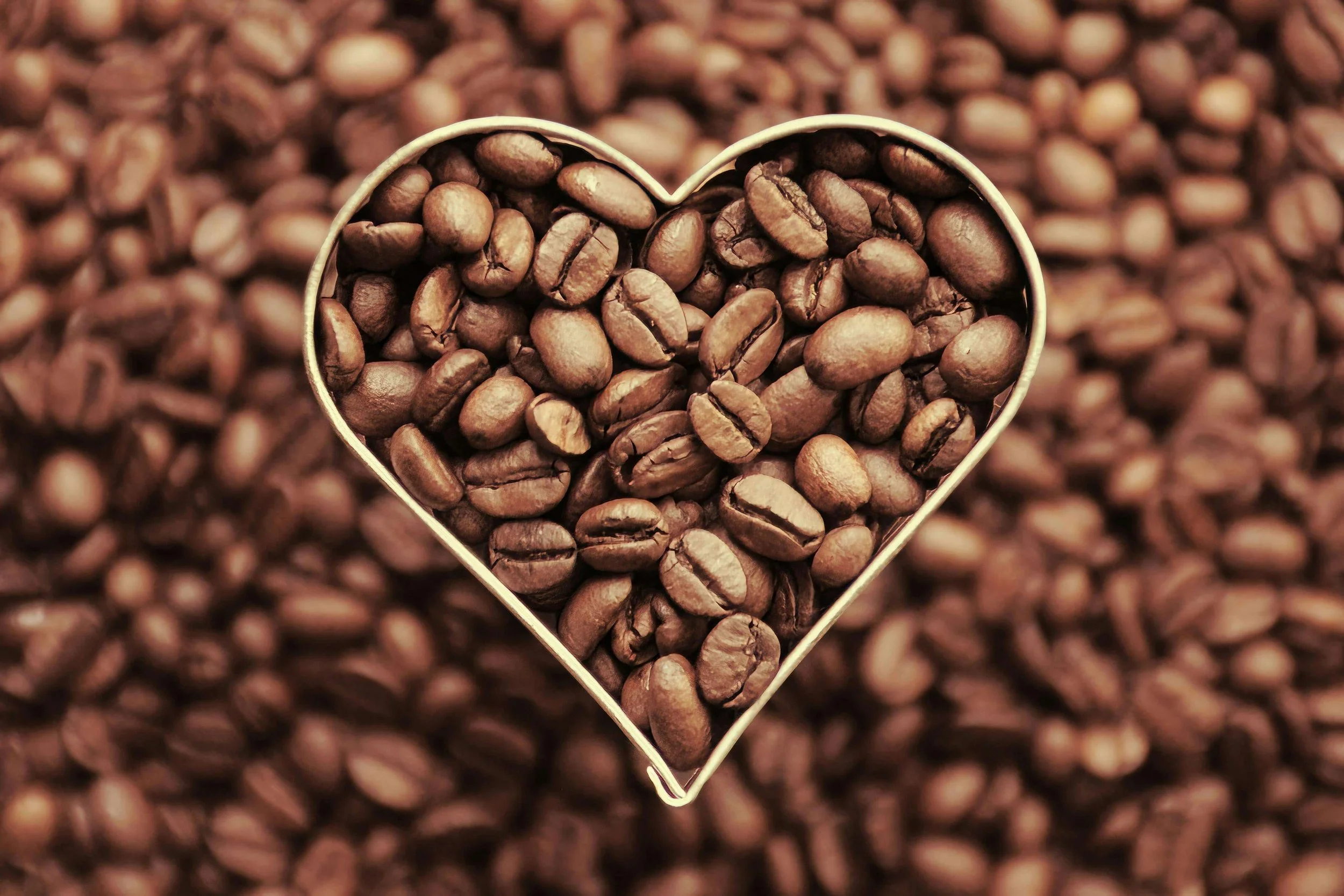 Chapter Coffee digital card with scattered coffee beans and a heart-shaped cookie cutter overlay a warm and thoughtful gift for coffee lovers