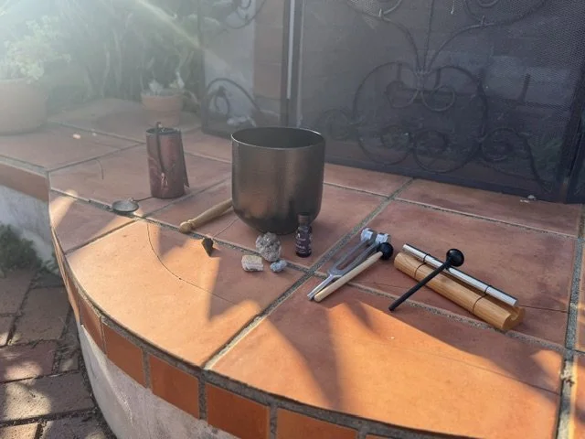 Elements of sound healing displayed outdoors.