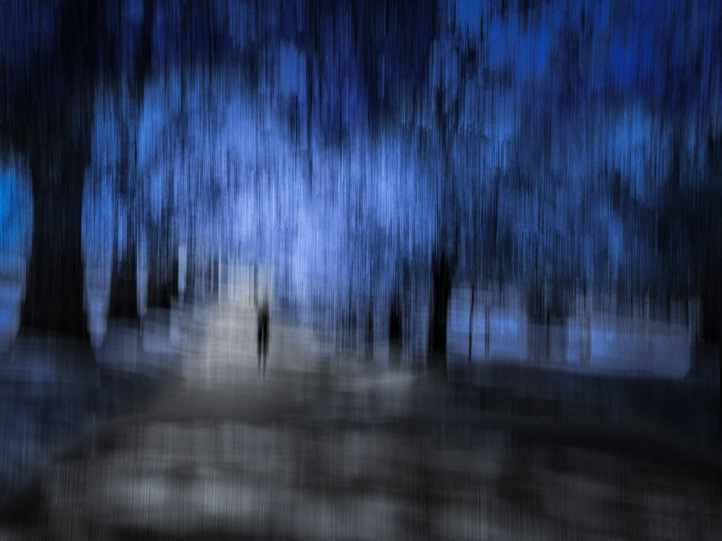 The Unknown Path – Duotone abstract ICM photograph in blue and grey with textured grain, showing blurred figure on a path.