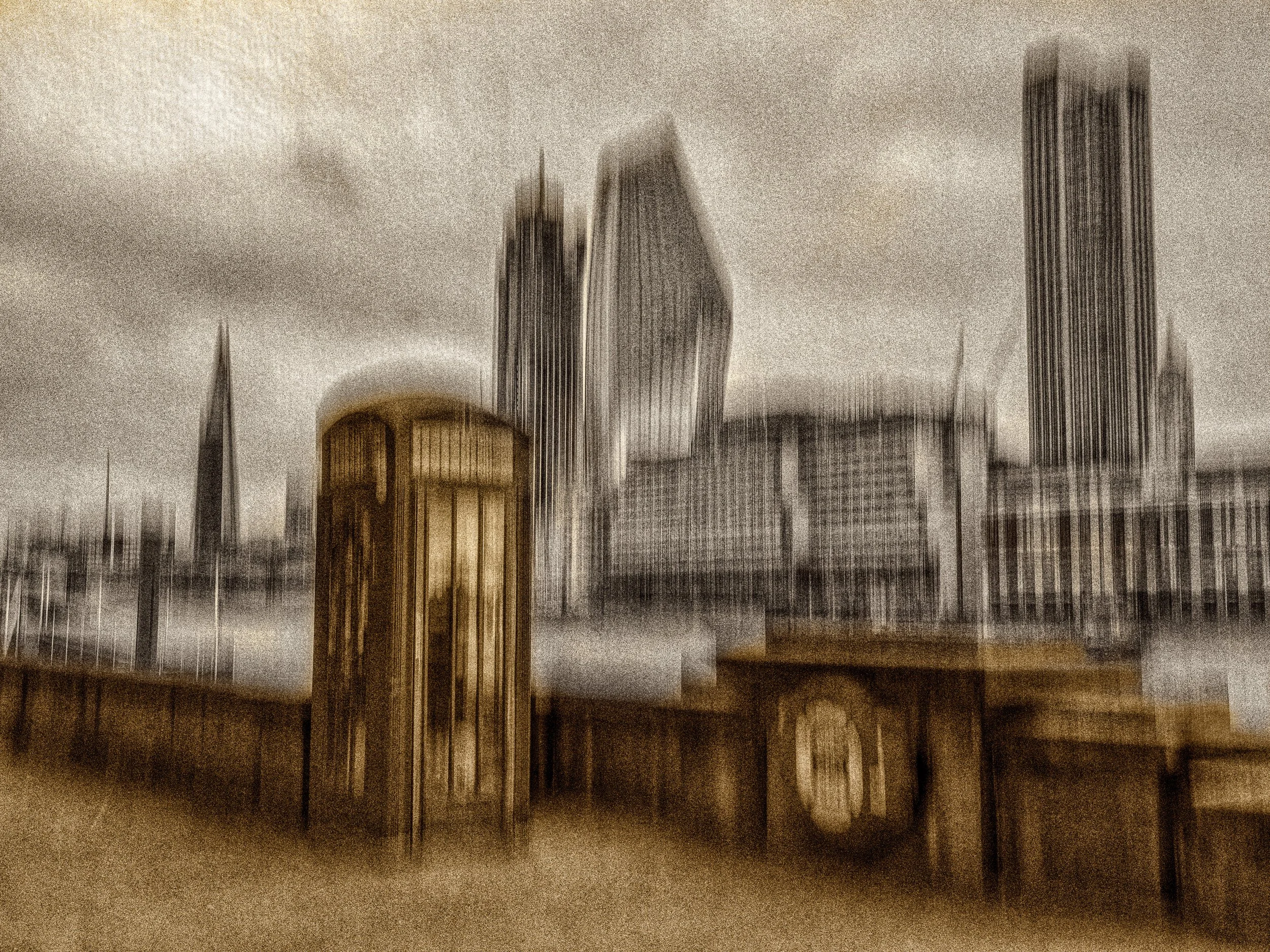 Sand and Grain – Duotone abstract ICM photograph of beige historic architecture and a grey modern skyline with vertical movement and photographic grain.