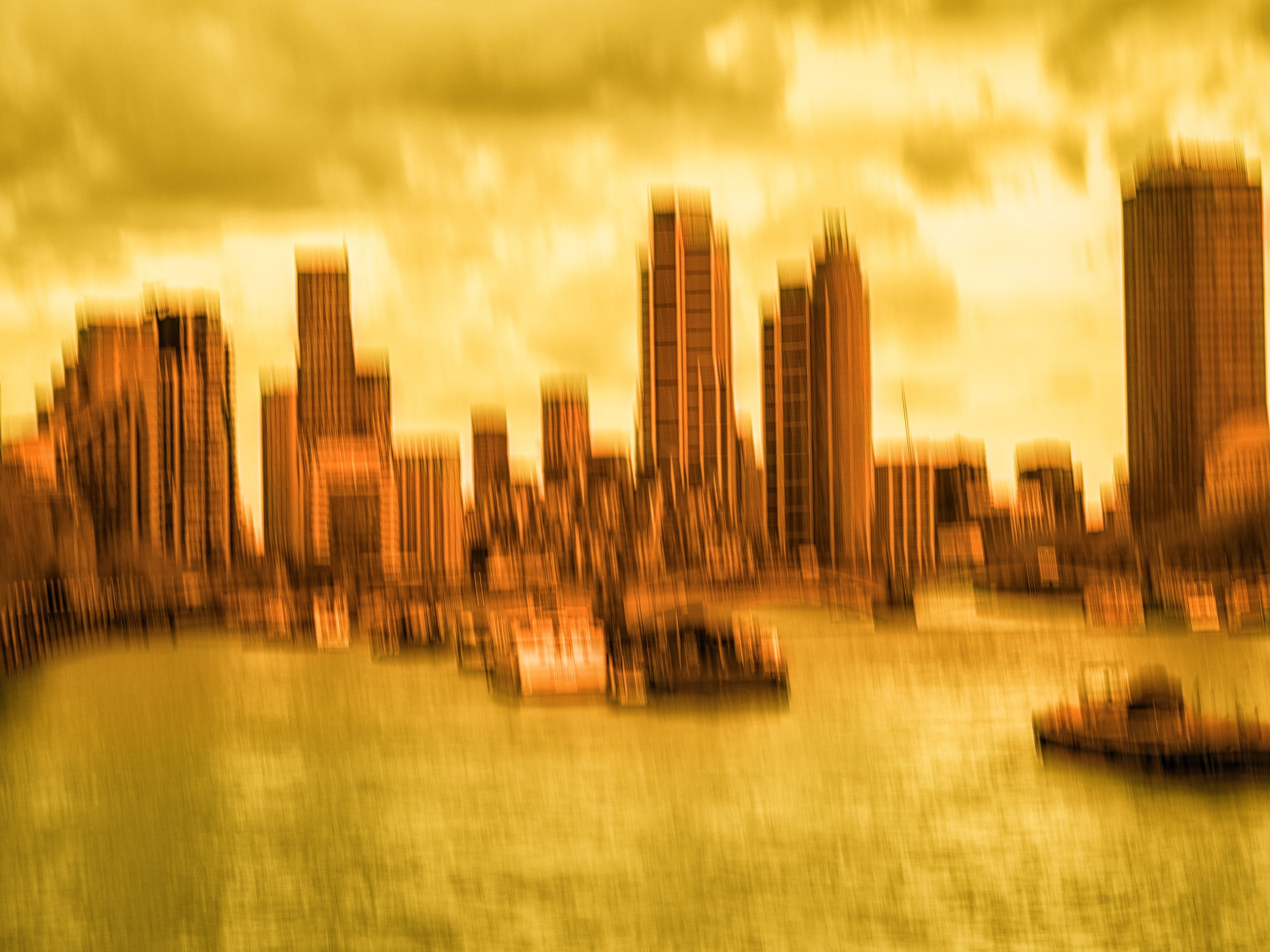 Where Energy Breathes – Duotone abstract ICM cityscape with flowing orange and yellow tones, capturing emotion through motion and texture.