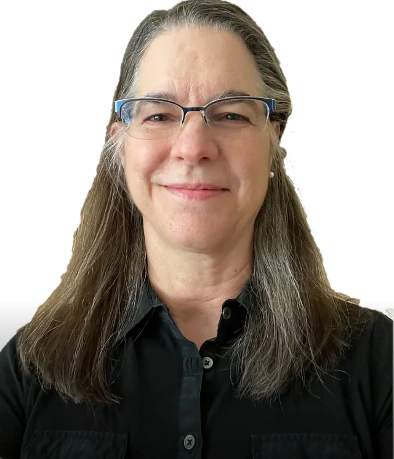 A woman with long straight hair, glasses, and a black shirt smiling in front of a white background.