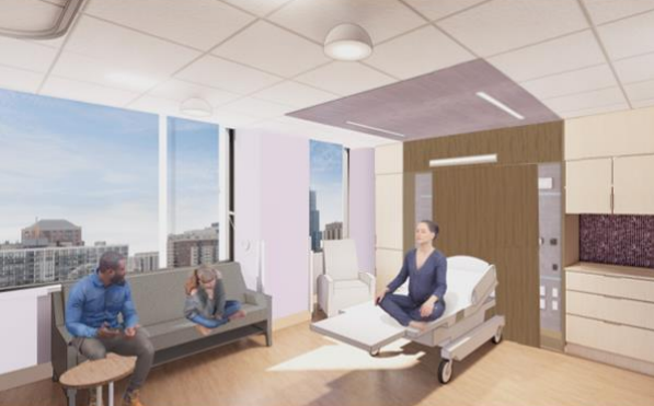 Hospital room with a patient in bed, two visitors seated nearby, and large windows showing city buildings outside.