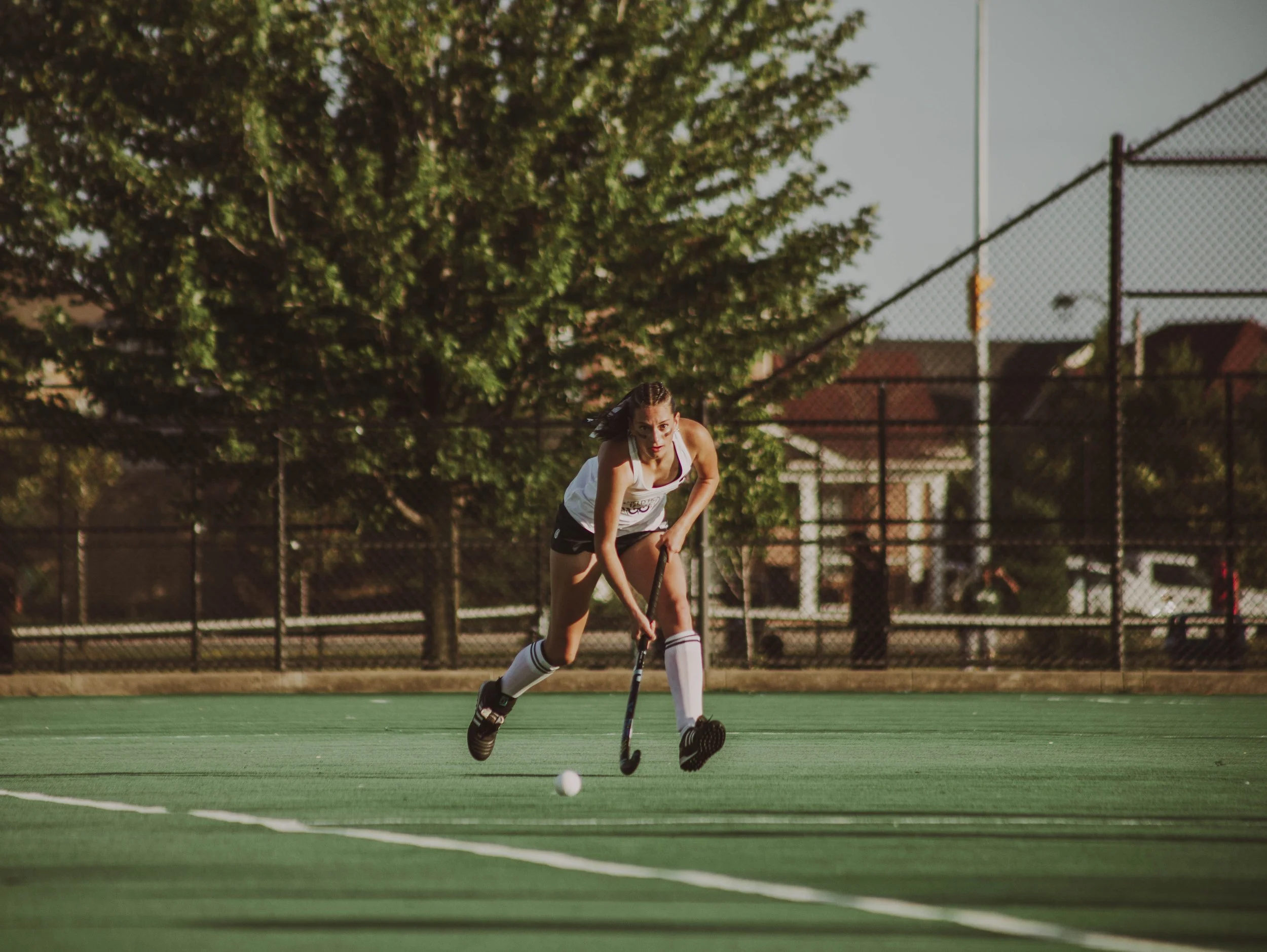Girls field hockey player 5 for Alberta attacking the ball