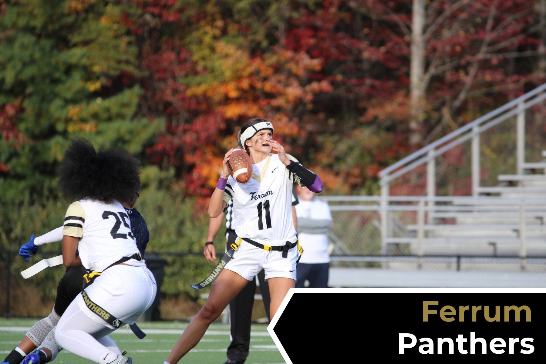 A female football player in a white and black uniform with the number 11 holding a football on a field, preparing to throw it, with autumn trees in the background and the text 'Ferrum Panthers' in a black and gold banner.