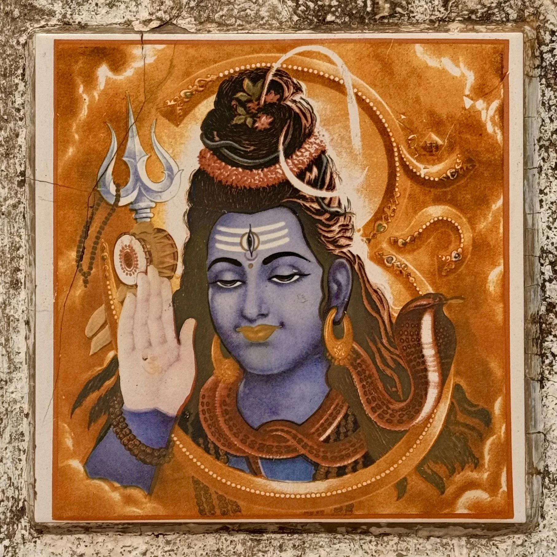 Artistic depiction of Hindu deity Shiva with trident and snake.