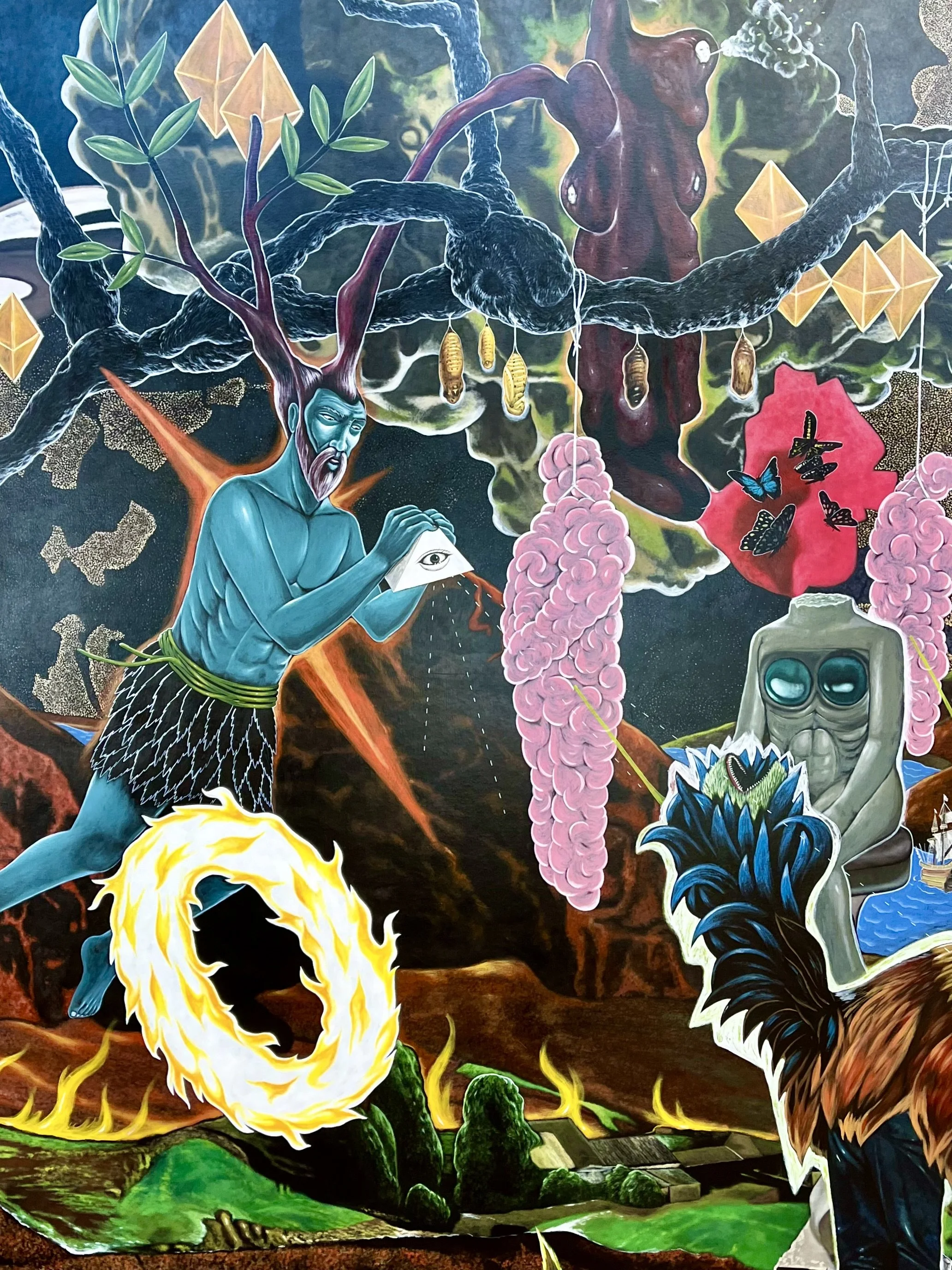 Surreal artwork with blue humanoid figure with horns, holding an eye symbol, surrounded by abstract elements like flames, butterflies, and geometric shapes.